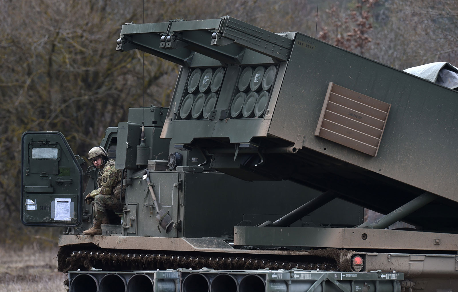 In this file image from 2020, A US soldier sits at a Multiple Launch Rocket System after an artillery live fire event by the US Army Europe's 41st Field Artillery Brigade at the military training area in Grafenwoehr, Germany.