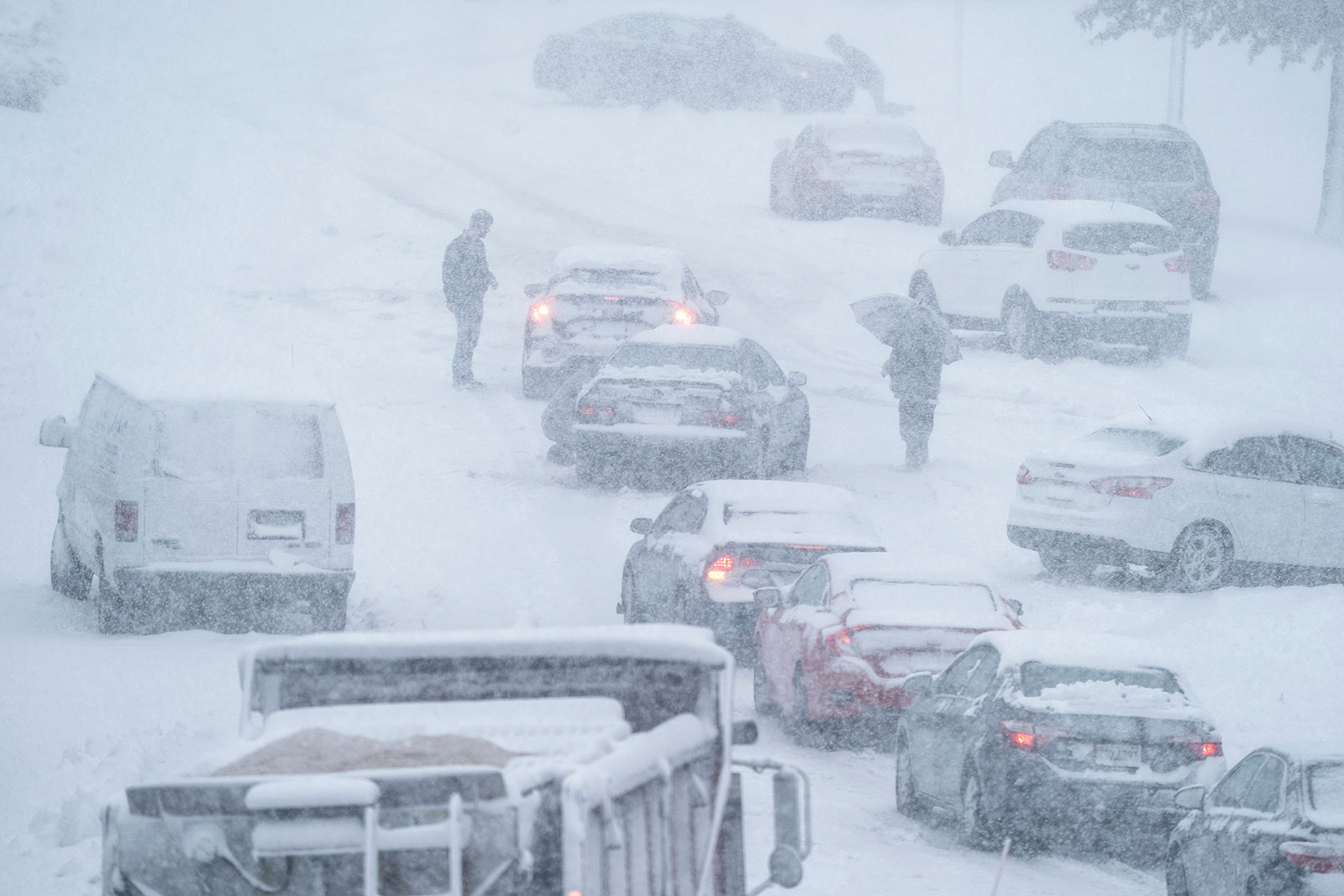 Cars stop along a snowy road in Arlington, Virginia, on January 3.