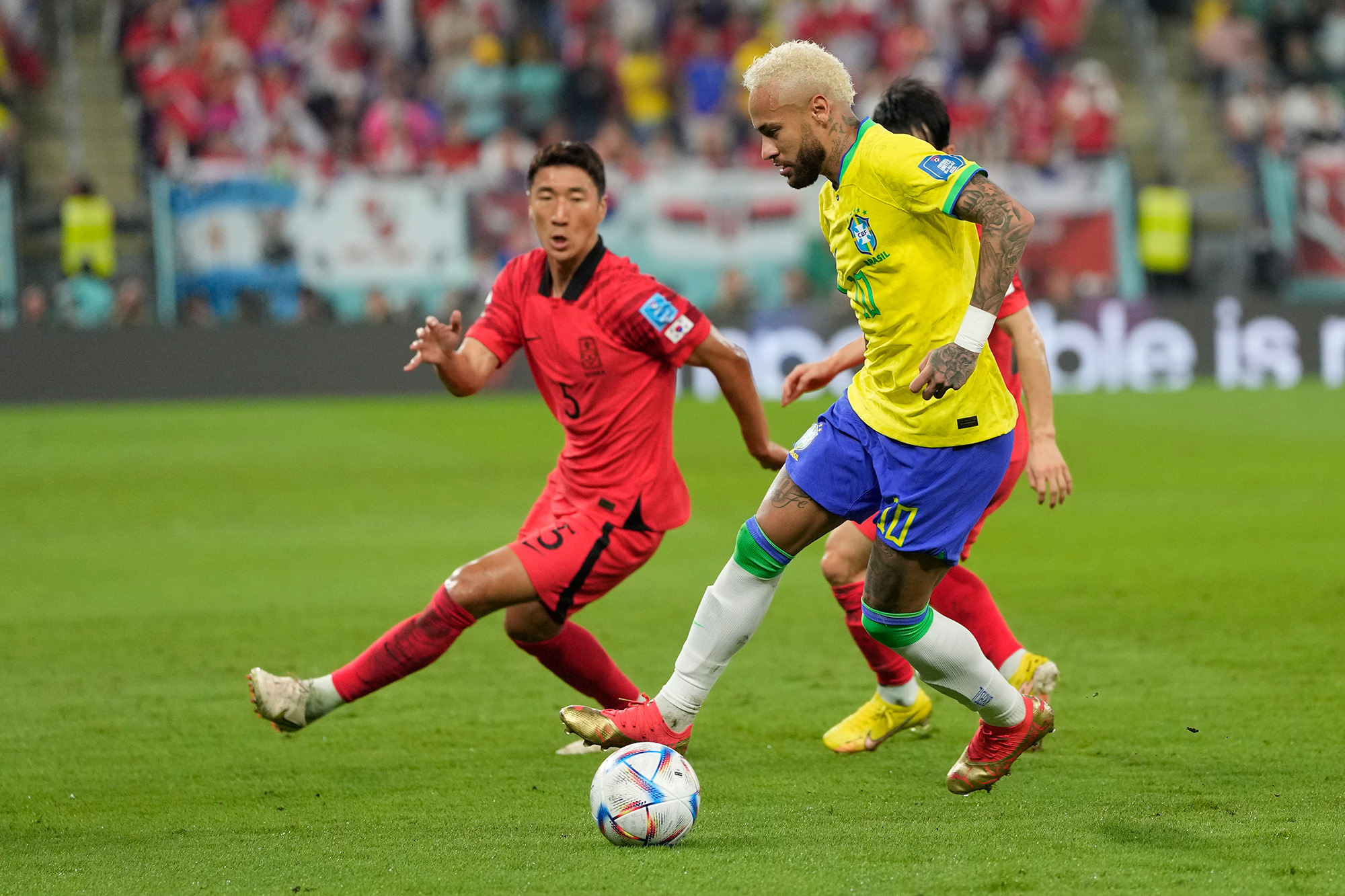 Brazil's Neymar, right, and South Korea's Jung Woo-youngn vie for the ball.