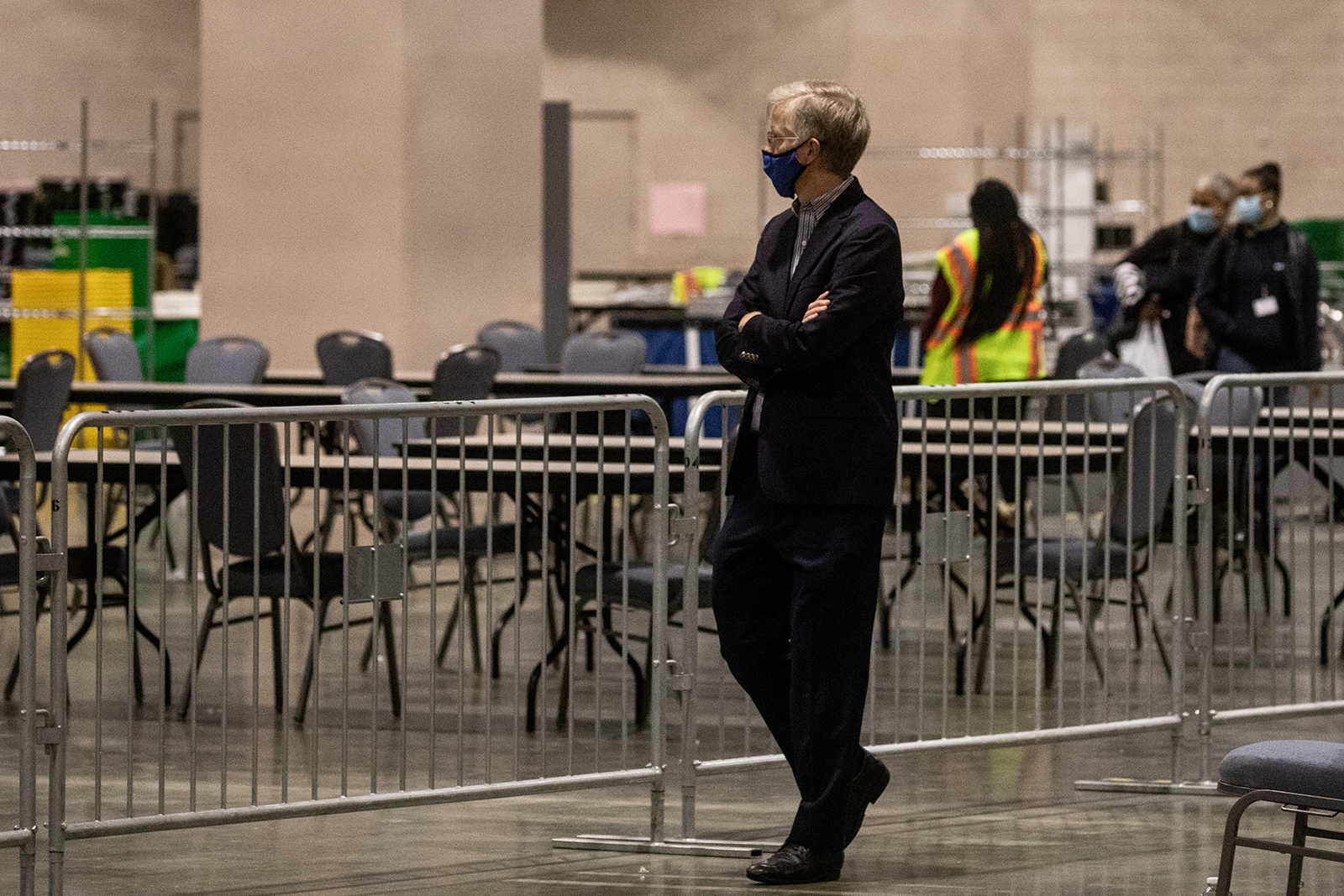 A man watches on from the observers area as election workers count ballots at the Philadelphia Convention Center on November 6, in Philadelphia, Pennsylvania. 