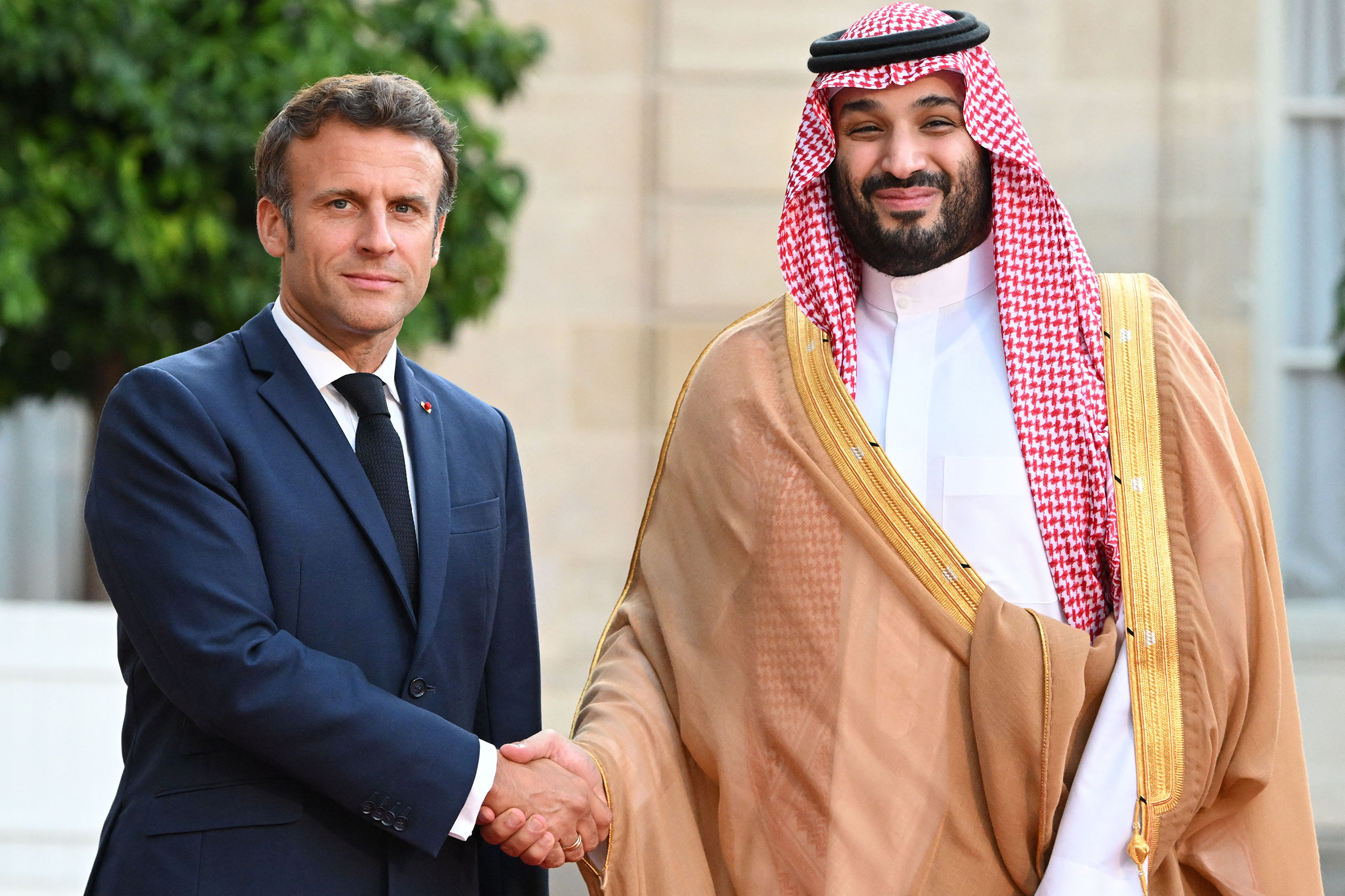 France's President Emmanuel Macron, left, greets Saudi Crown Prince Mohammed bin Salman as he arrives at the presidential Elysee Palace in Paris, France, on July 28.