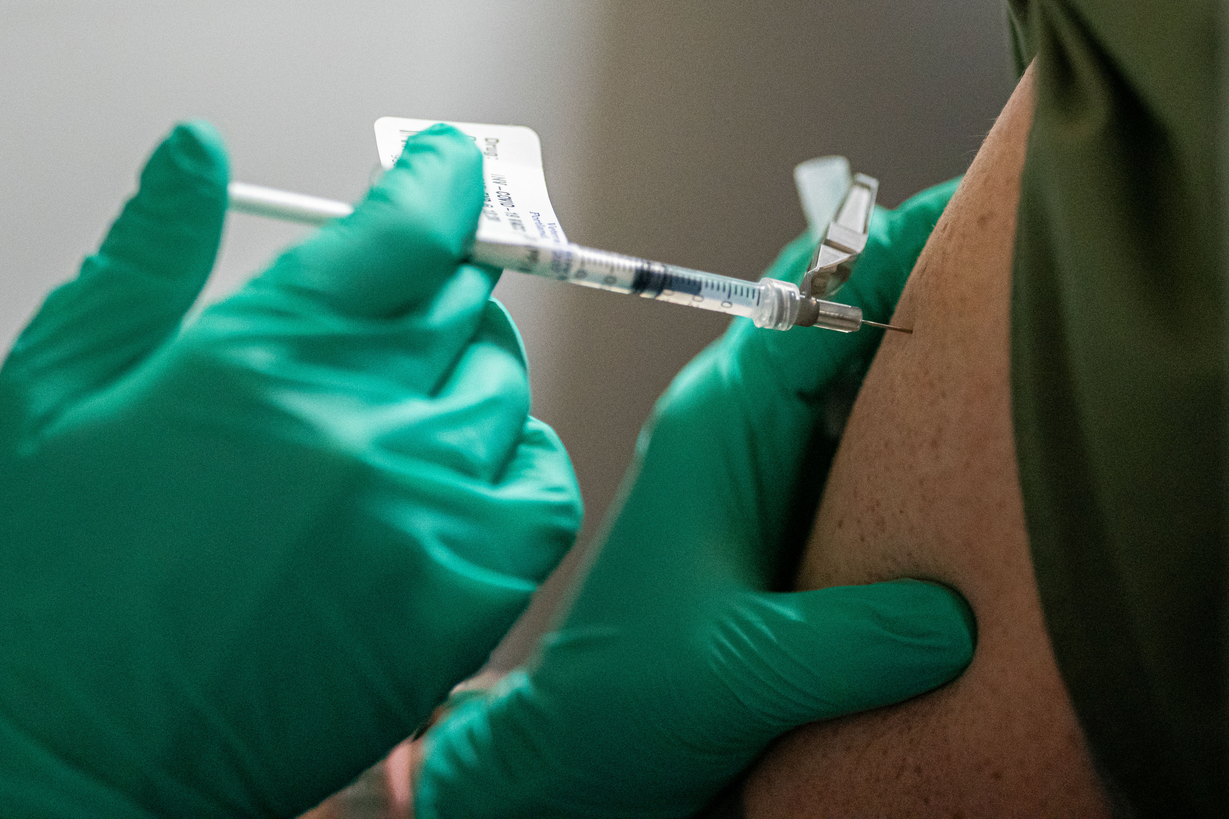 A health care worker at the Portland Veterans Affairs Medical Center in Oregon receives a Covid-19 vaccination on December 16.