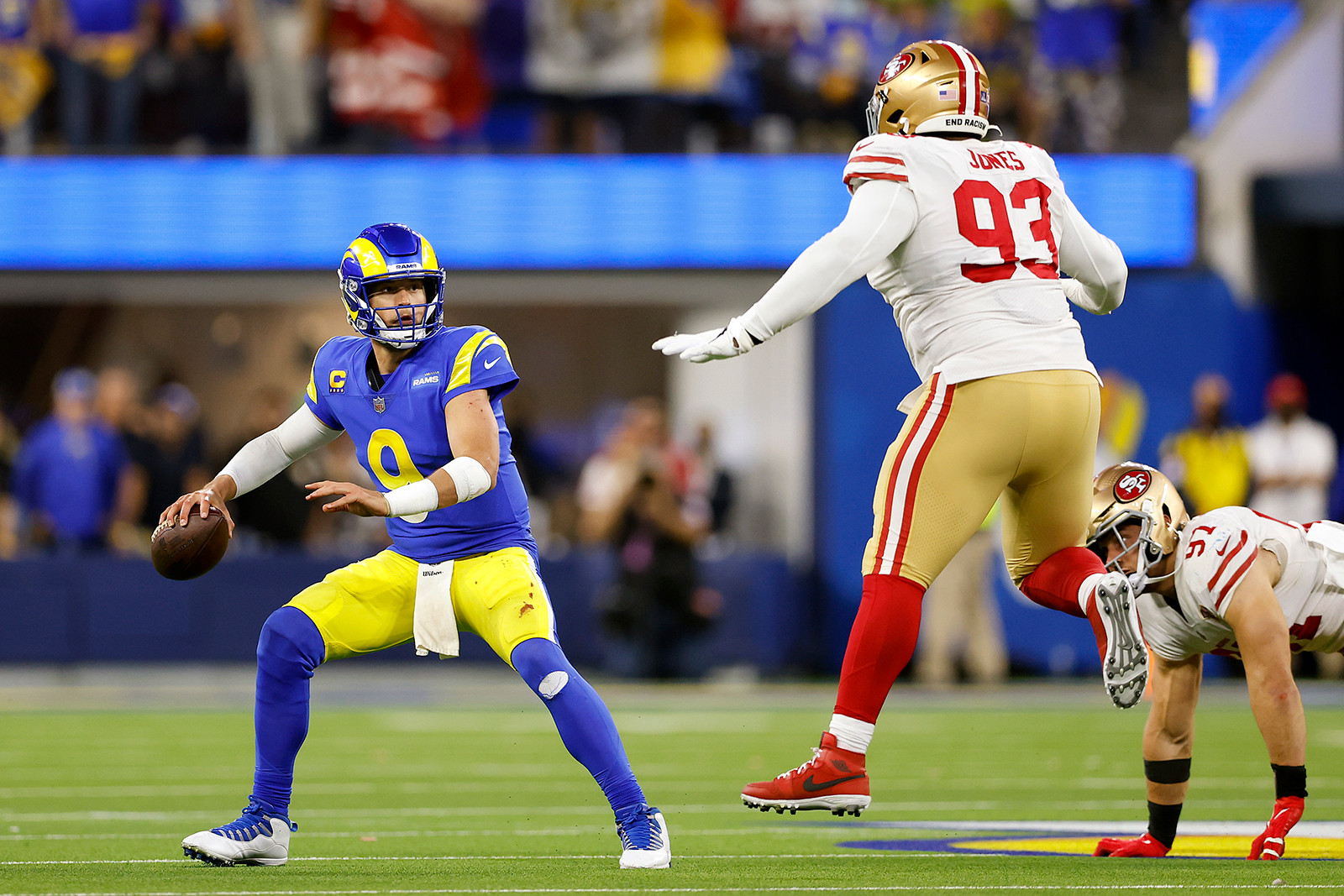 Matthew Stafford #9 of the Los Angeles Rams looks to pass against D.J. Jones #93 of the San Francisco 49ers in the third quarter during the NFC Championship Game at SoFi Stadium on January 30, in Inglewood, California.