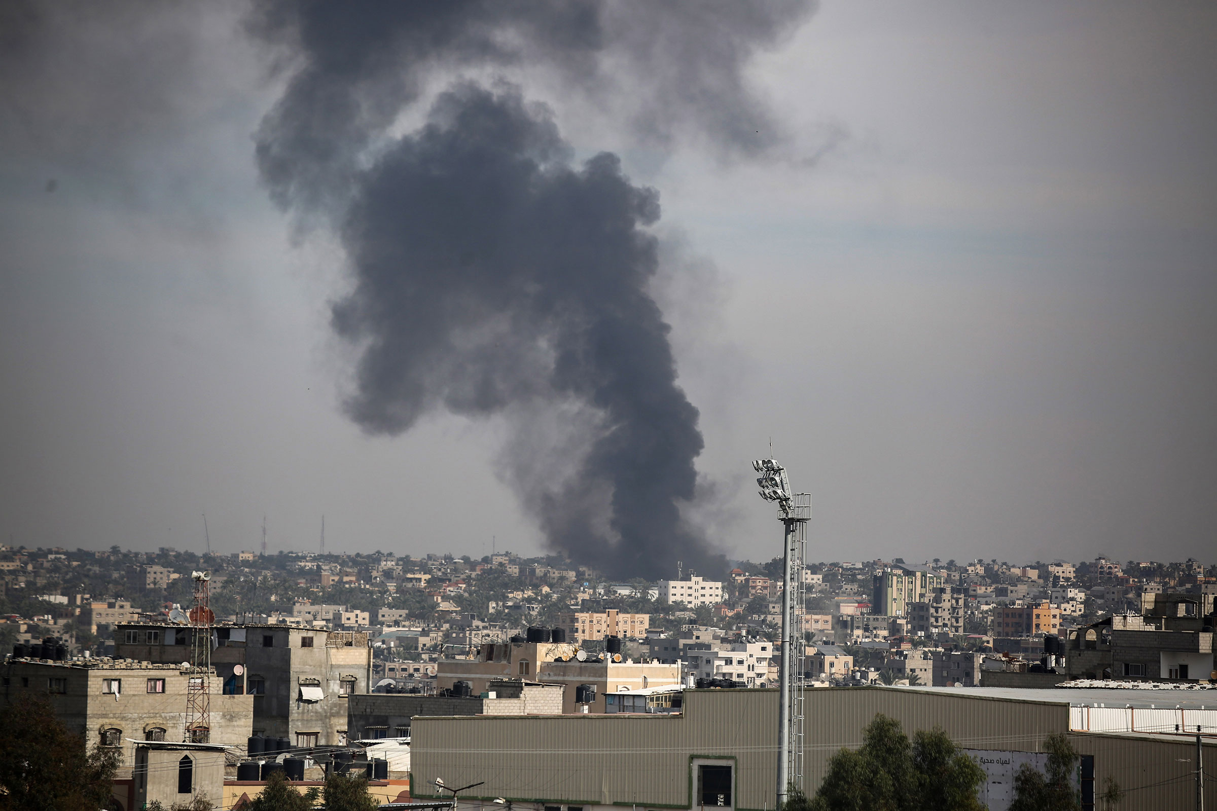 Smoke rising from Israeli air strikes on the city of Khan Yunis on December 20, in Khan Yunis, Gaza.