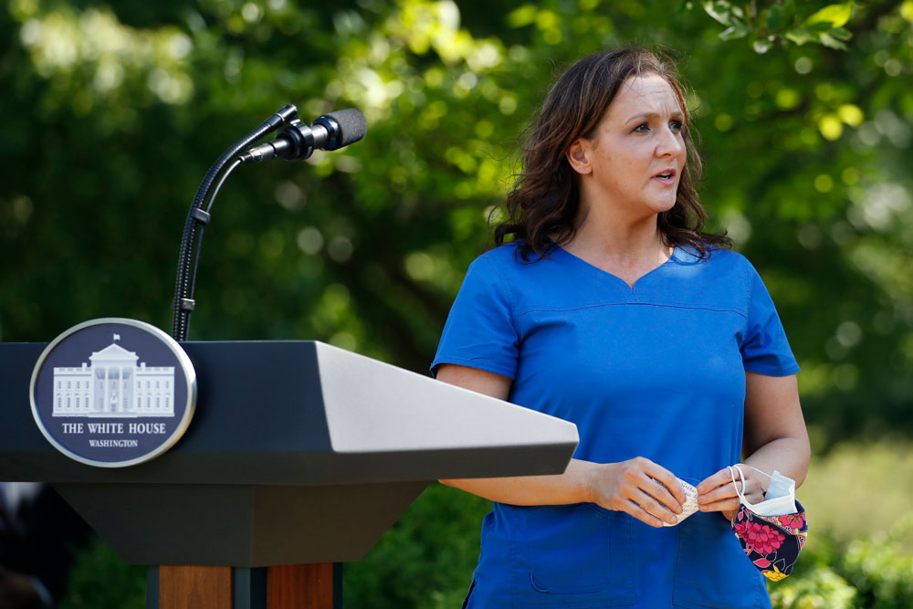 Nurse Amy Ford answers a question from President Donald Trump during a presidential recognition ceremony in the Rose Garden of the White House, on Friday, May 15, in Washington.