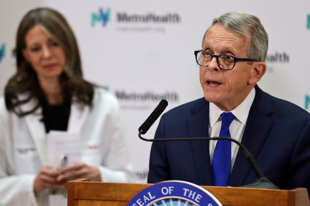 In this Thursday, February 27, file photo, Ohio Governor Mike DeWine gives an update at MetroHealth Medical Center on the state's preparedness and education efforts to limit the potential spread of the coronavirus in Cleveland.