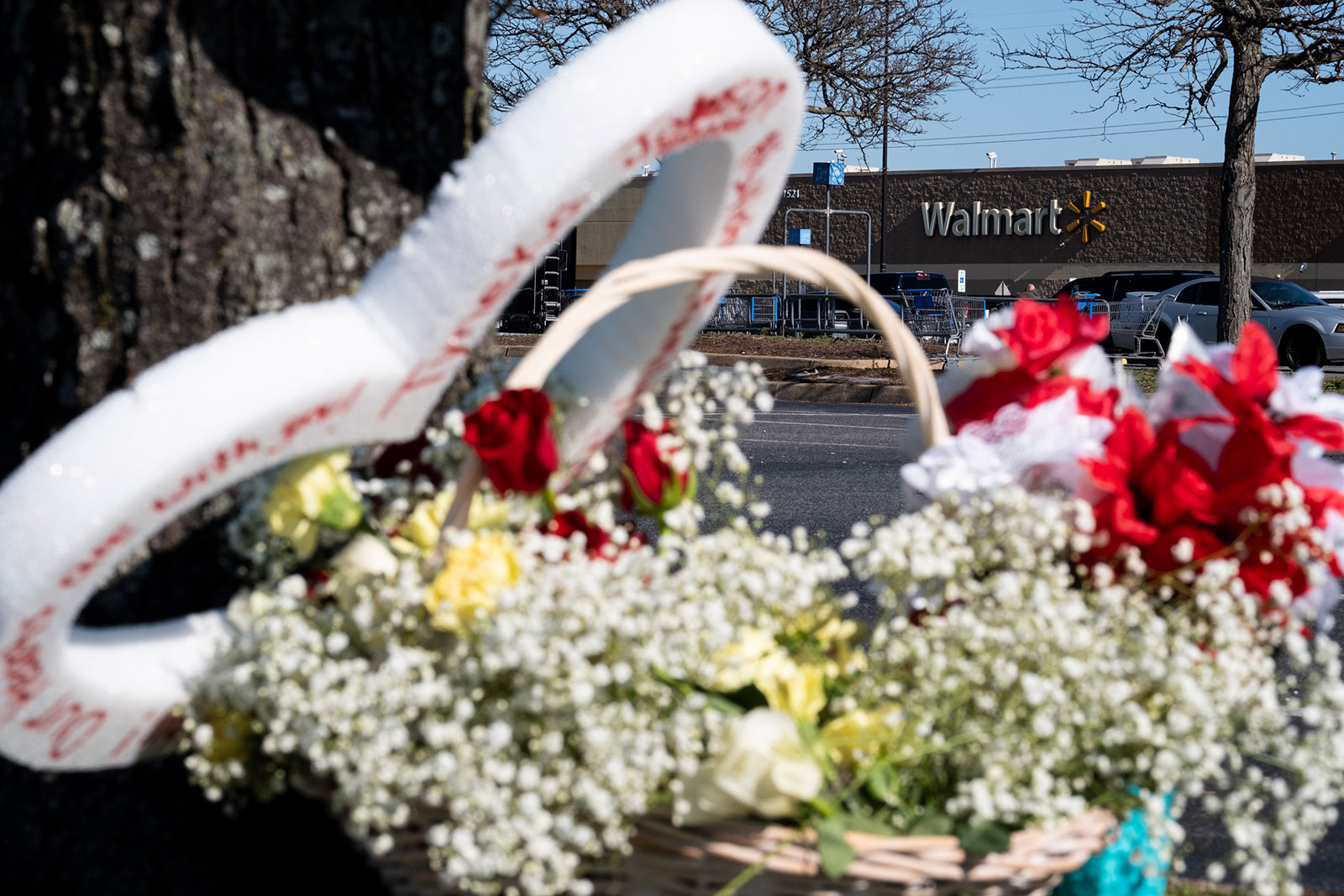 Flowers are placed near the Walmart store in Chesapeake, Virginia, where a shooting took place. 