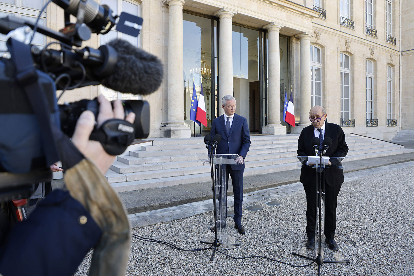 France's Foreign Minister Jean-Yves Le Drian, right, speaks during a press conference in Paris on February 28.