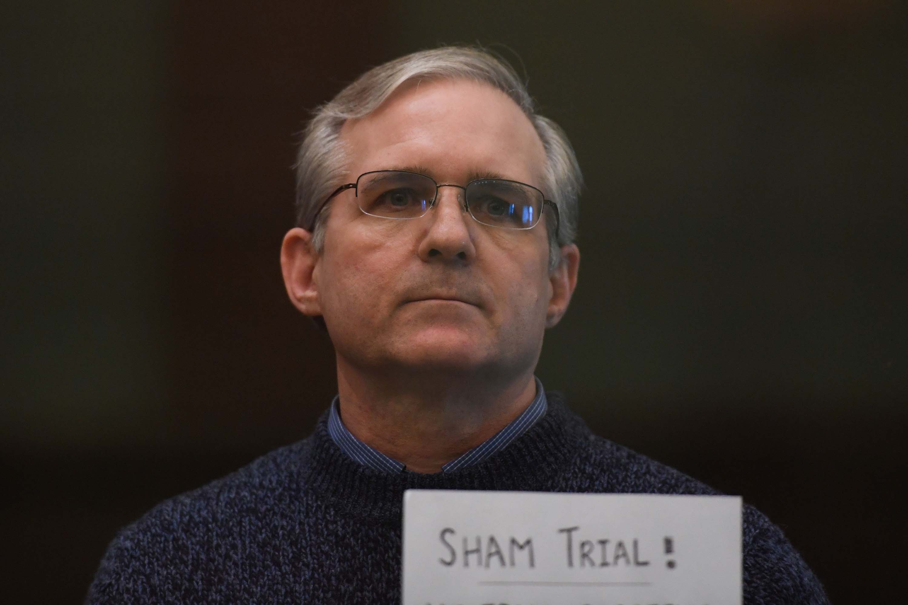 Paul Whelan, a former US marine accused of espionage and arrested in Russia in December 2018, stands inside a defendants' cage as he waits to hear his verdict in Moscow on June 15, 2020.