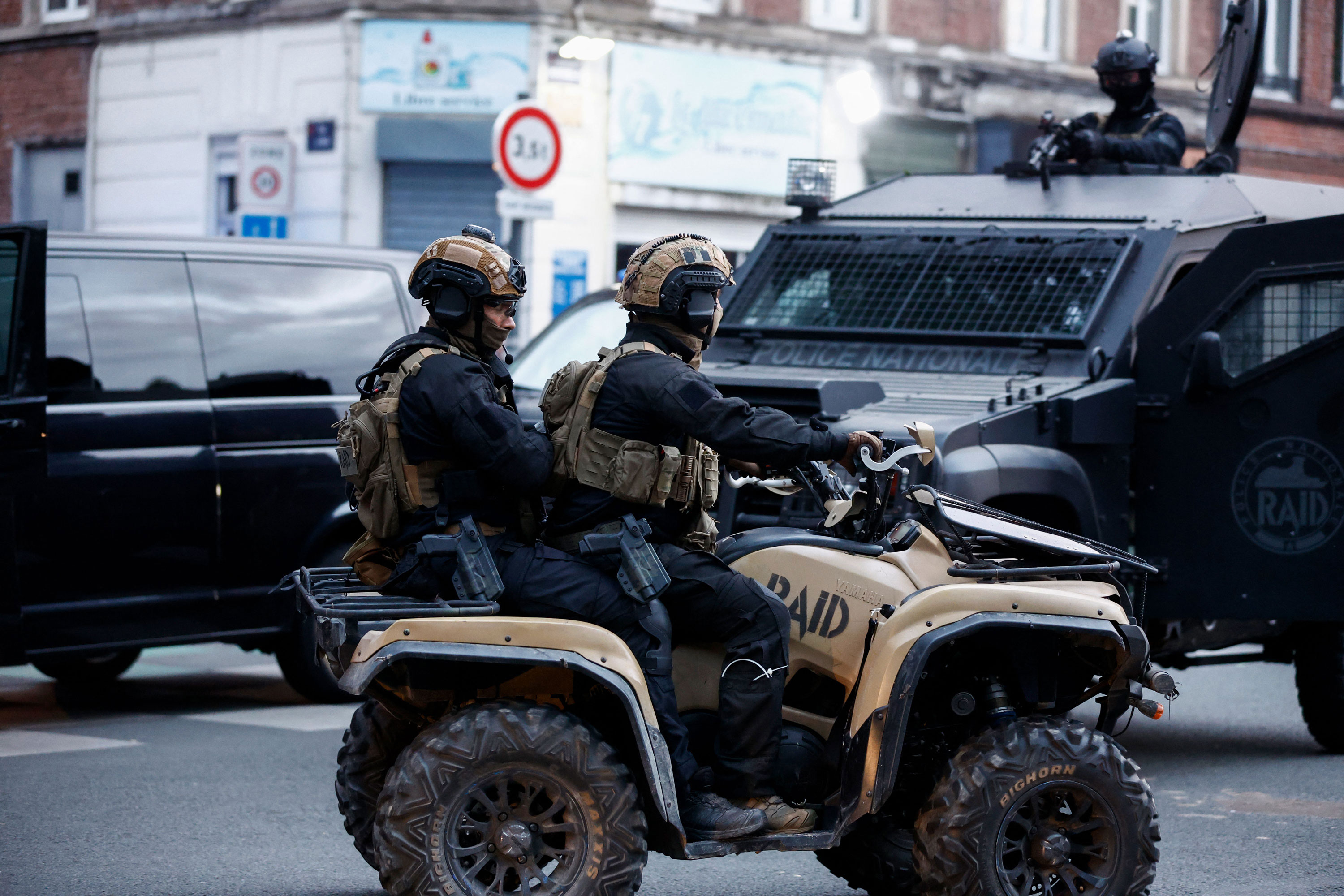 Police officers of unit RAID (Research, Assistance, Intervention, Deterrence) ride a quad during protests in Lille, northern France, on June 29.