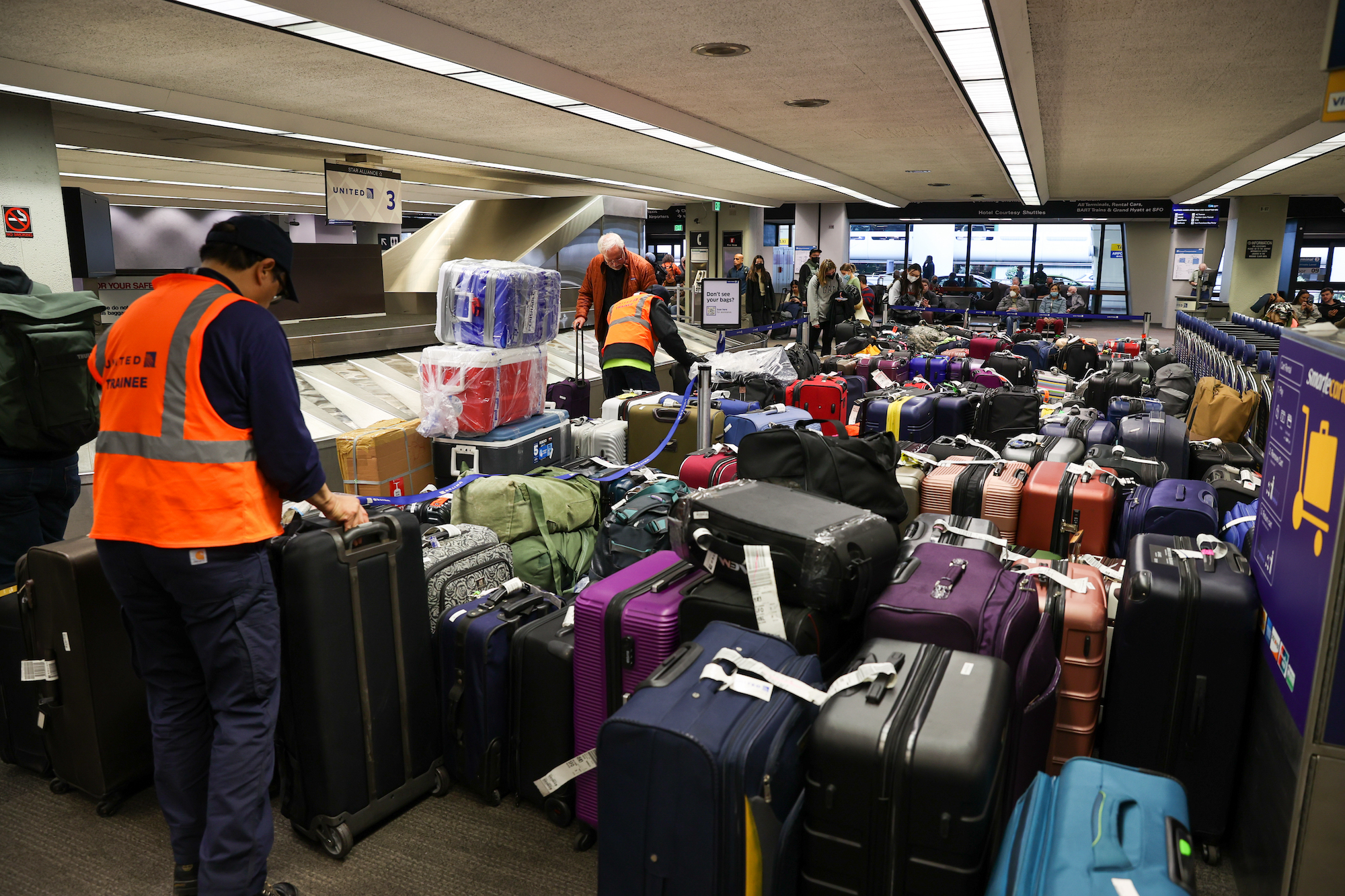 Luggage is seen at San Francisco International Airport due to airline cancellations on Friday.