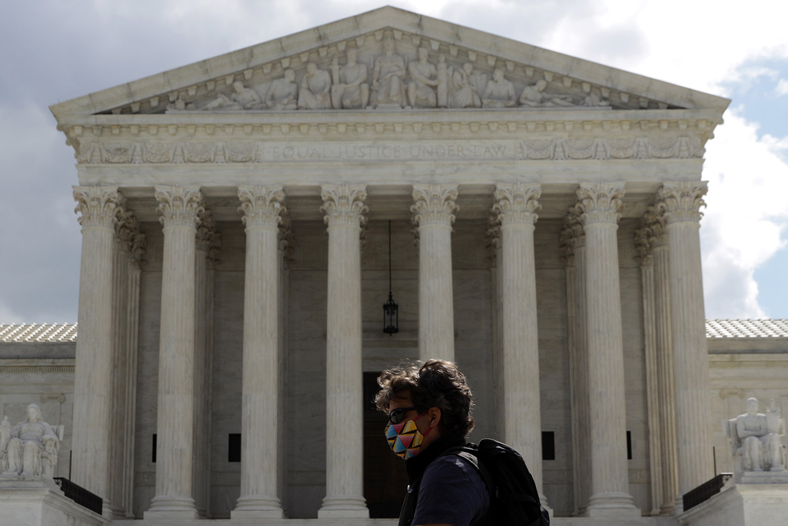  A pedestrian walks in front of the Supreme Court building on Tuesday.