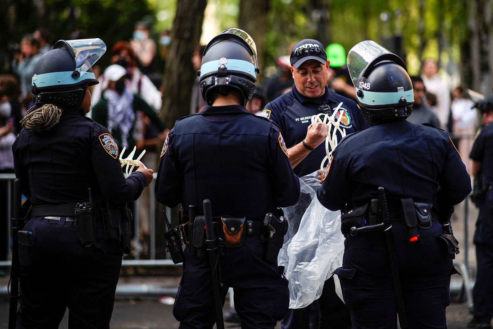 NYPD officers prepare to detain protesters outside the Fordham Lincoln Center campus in New York on Wednesday, May 1. 