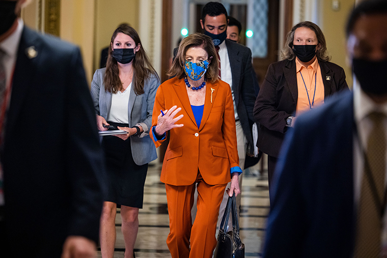 Speaker of the House Nancy Pelosi walks off the House floor following a procedural vote on suspending the debt limit on Wednesday, September 29. 