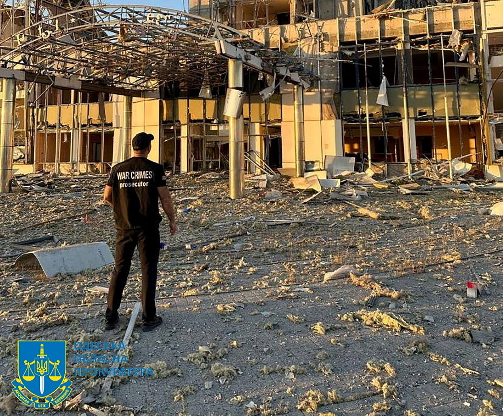 A member of Odesa Regional Prosecutor's Office personnel inspects damage following a Russian military attack in Odesa, Ukraine, in this image released on September 25.