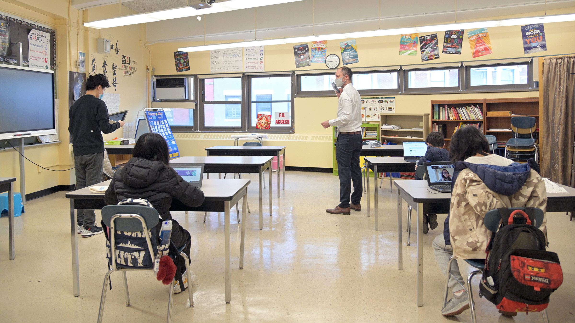 Principal Ben Geballe speaks with students at Sun Yat Sen M.S. 131 on February 25, in New York City. 