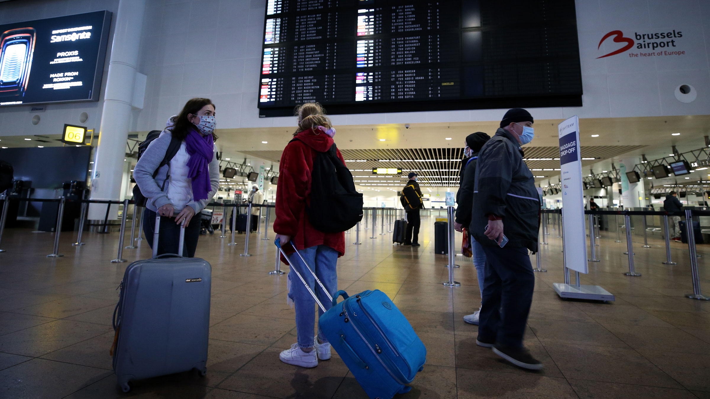 Travelers walk at Brussels Airport in Belgium after flights to the United Kingdom resumed on December 23.