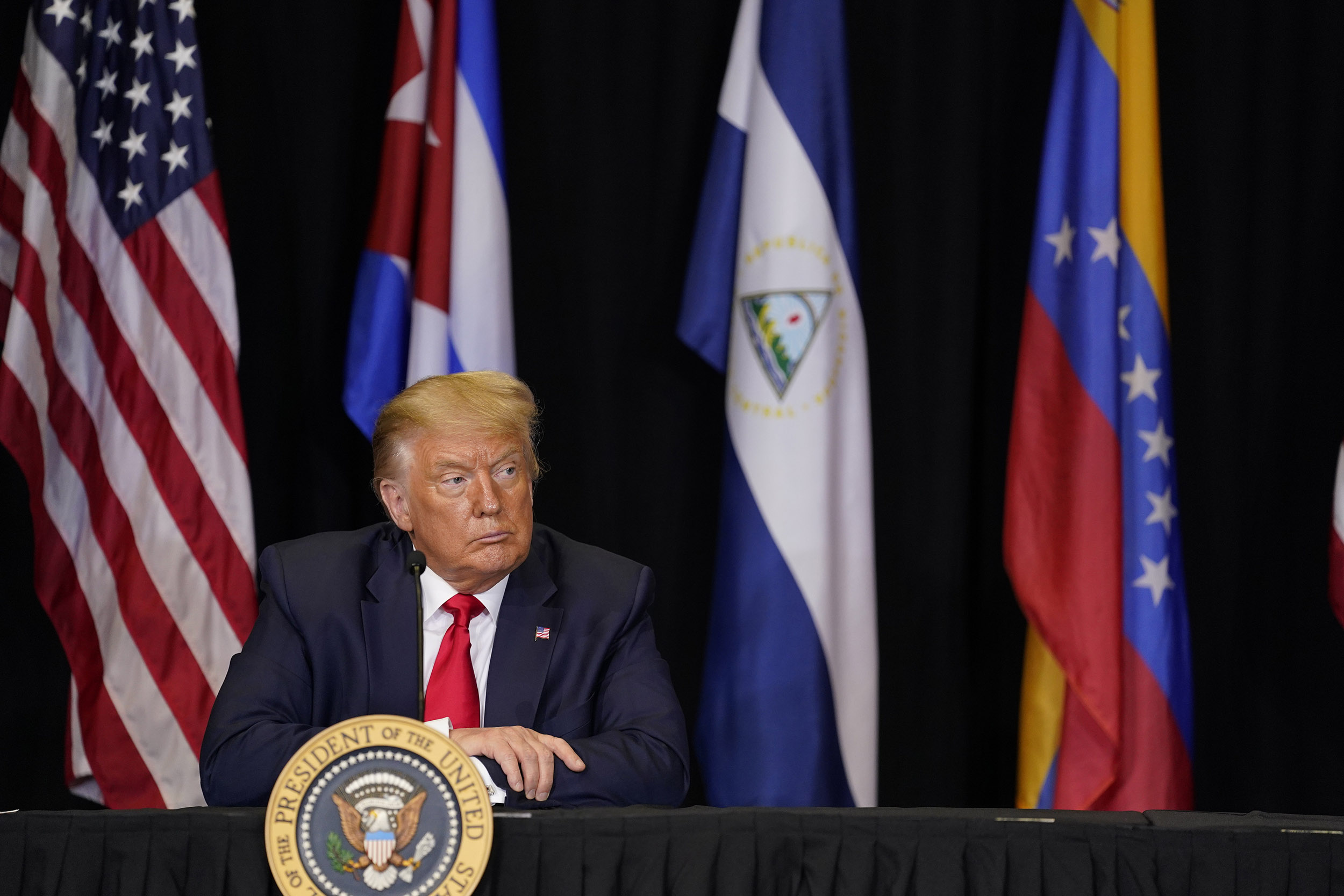 President Donald Trump listens during a roundtable on Venezuela at Iglesia Doral Jesus Worship Center, on Friday, July 10, in Doral, Florida. 