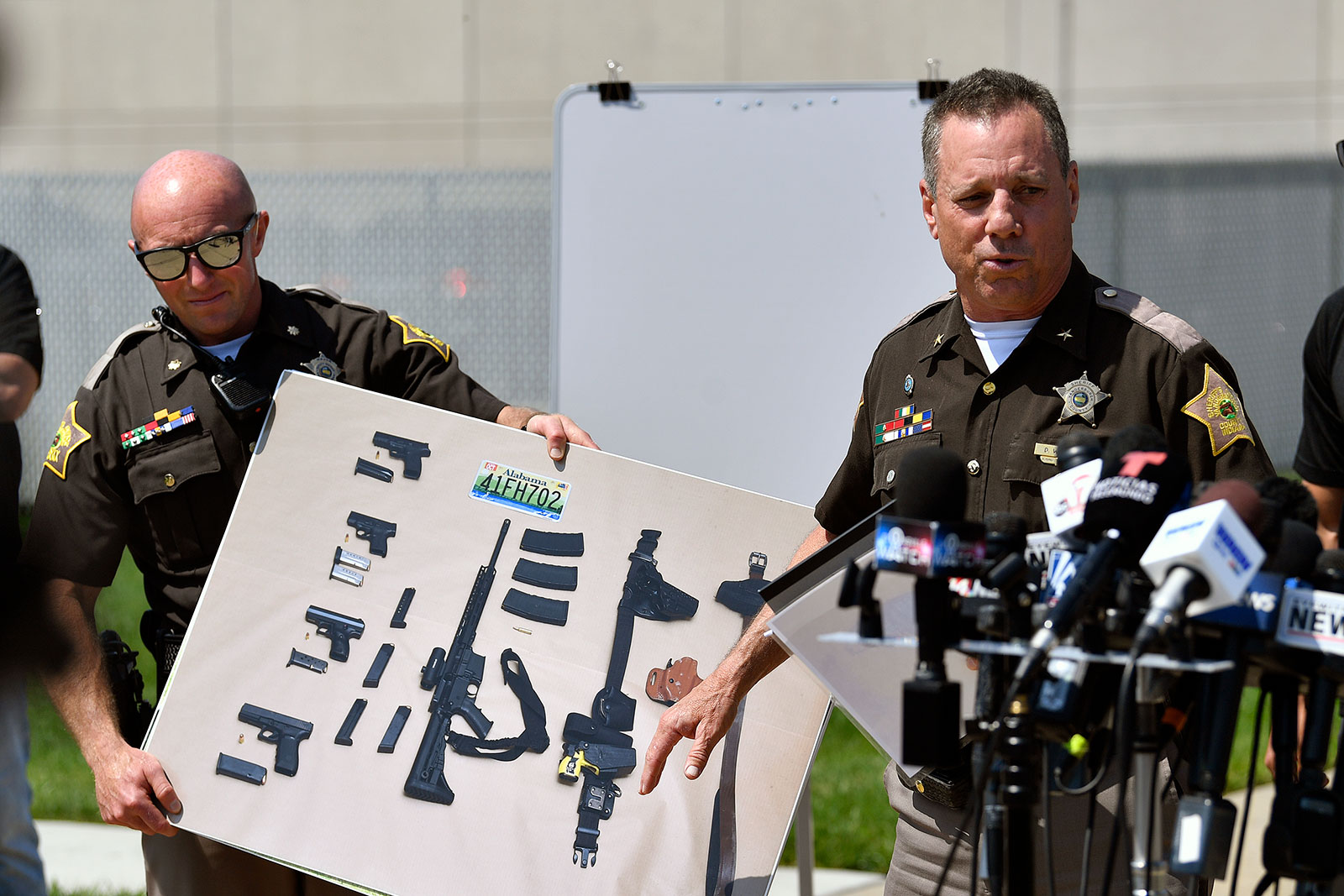 Vanderburgh County Sheriff Dave Wedding shows a photograph of the weapons that were found in the possession of fugitives Casey White and Vicky White following their capture during a press conference in Evansville, Indiana,  May 10.