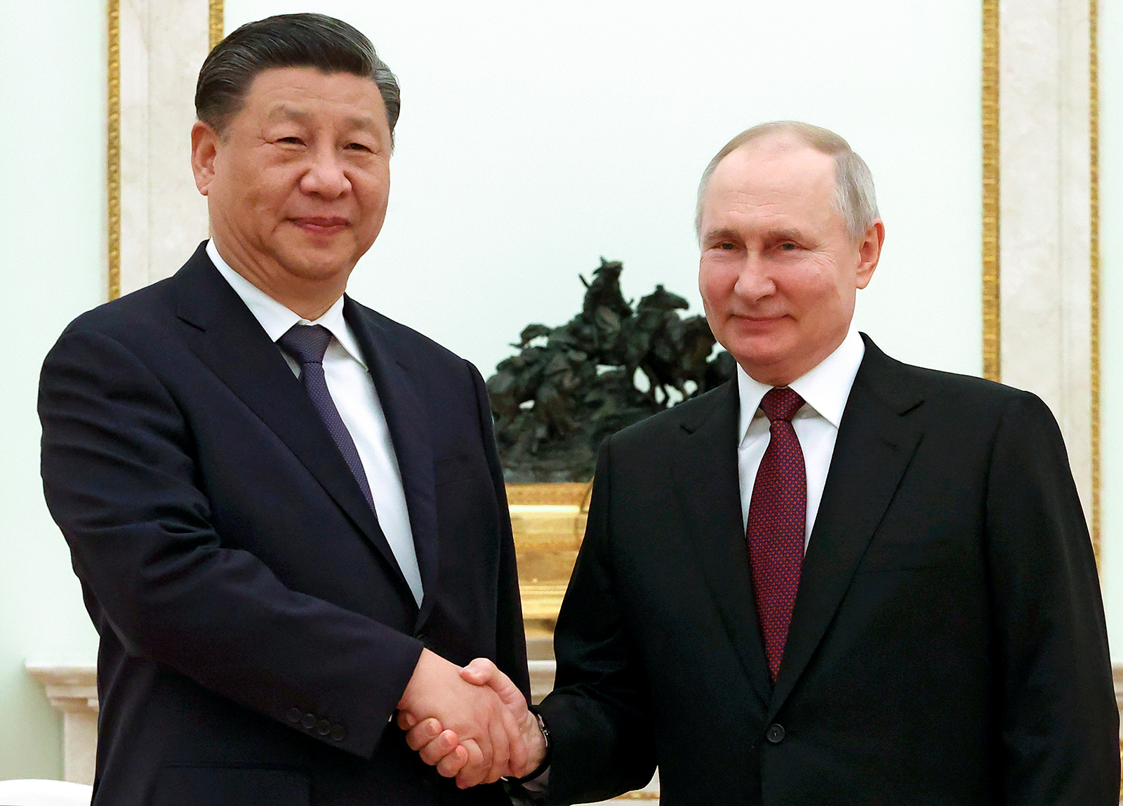 Xi Jinping and Vladimir Putin pose for a photo during their meeting at the Kremlin on March 20.