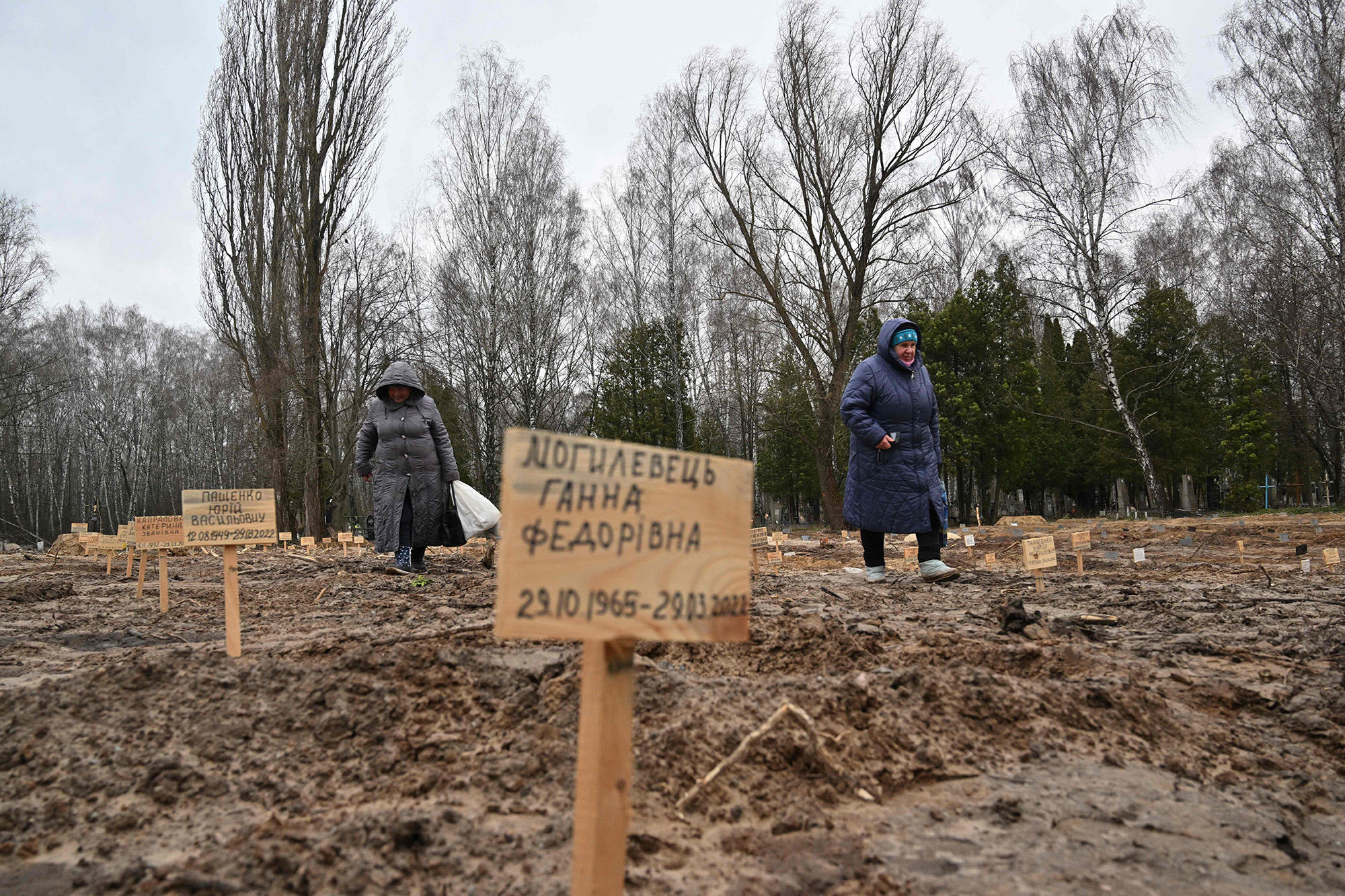 A resident searches for the graves of relatives in a cemetery in Chernigiv, northern Ukraine, on April 5.