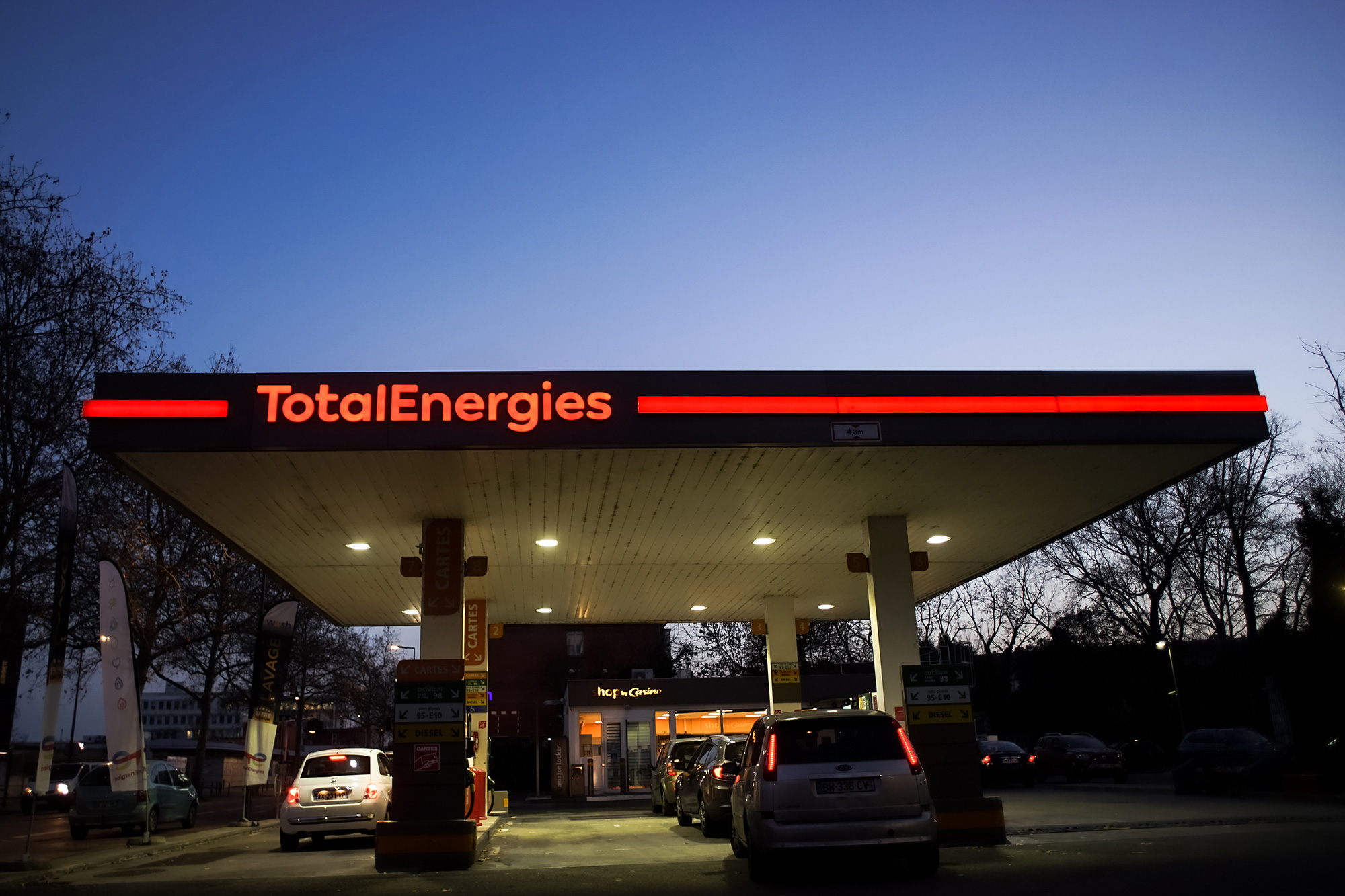 Customers refuel at a TotalEnergies SE gas station in Toulouse, France, on Thursday, Feb. 10, 2022. 