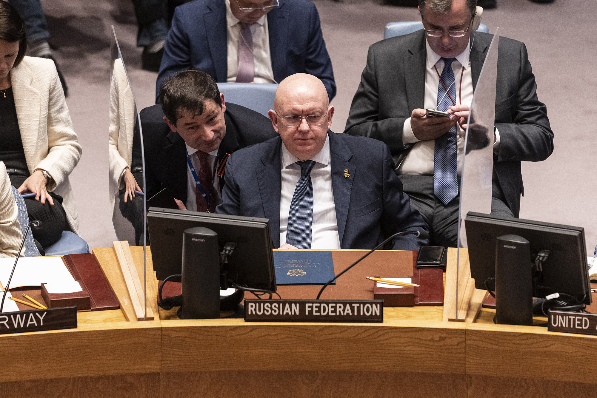 Russian Ambassador Vassily Nebenzia consults with ambassador Dmitry Polyanskiy, center, during a Security Council meeting on maintenance of peace and security of Ukraine at UN Headquarters in New York, US, on May 5