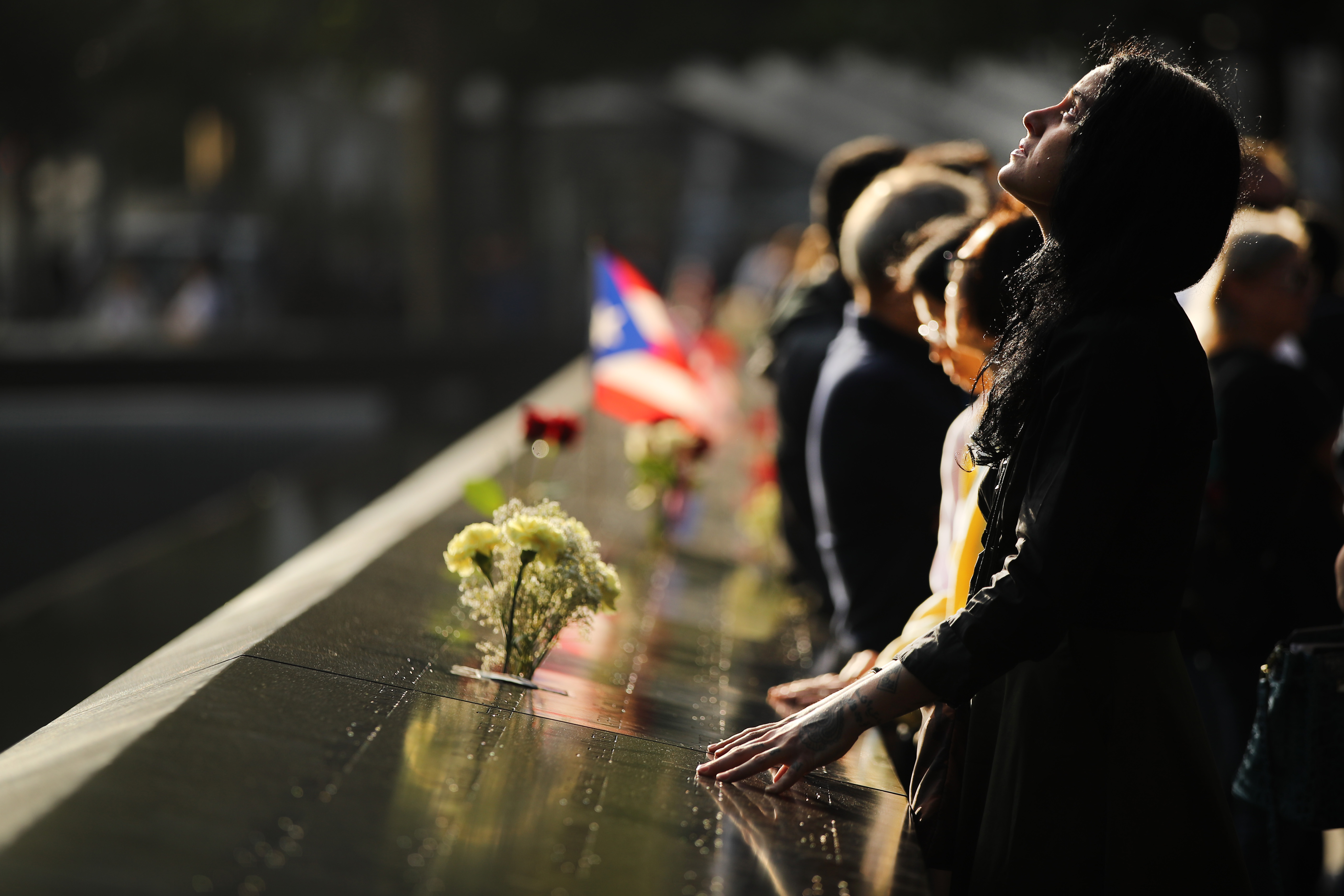 Alexandra Hamatie, whose cousin Robert Horohoe was killed on September 11, pauses at the National September 11 Memorial.
