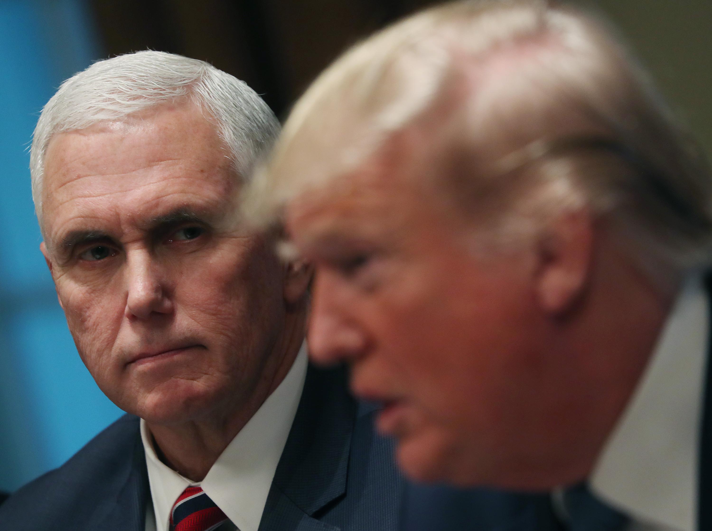 In this December 9, 2019 file photo, US Vice President Mike Pence listens to US President Donald Trump in the Cabinet Room in Washington.