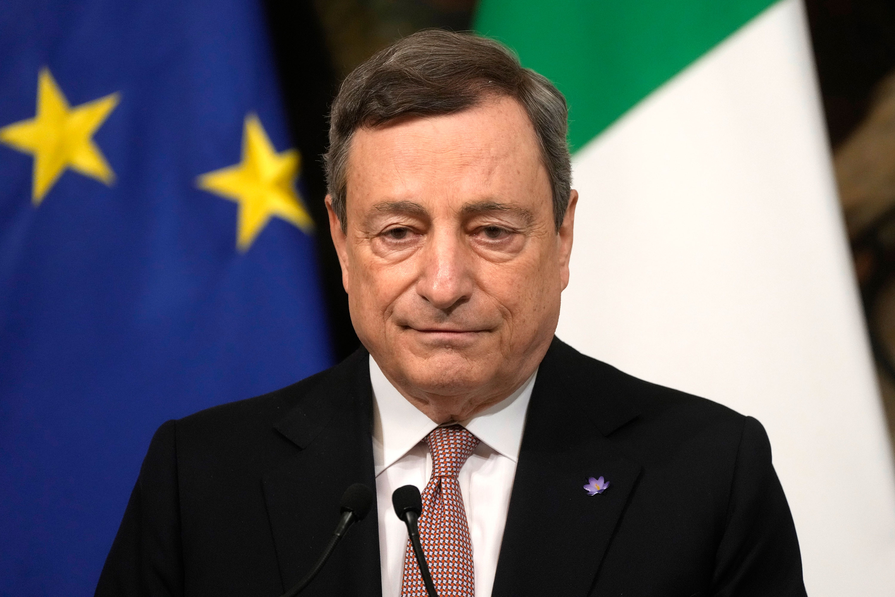 Italian Prime Minister Mario Draghi listens to a question during a press conference in Rome on Thursday.