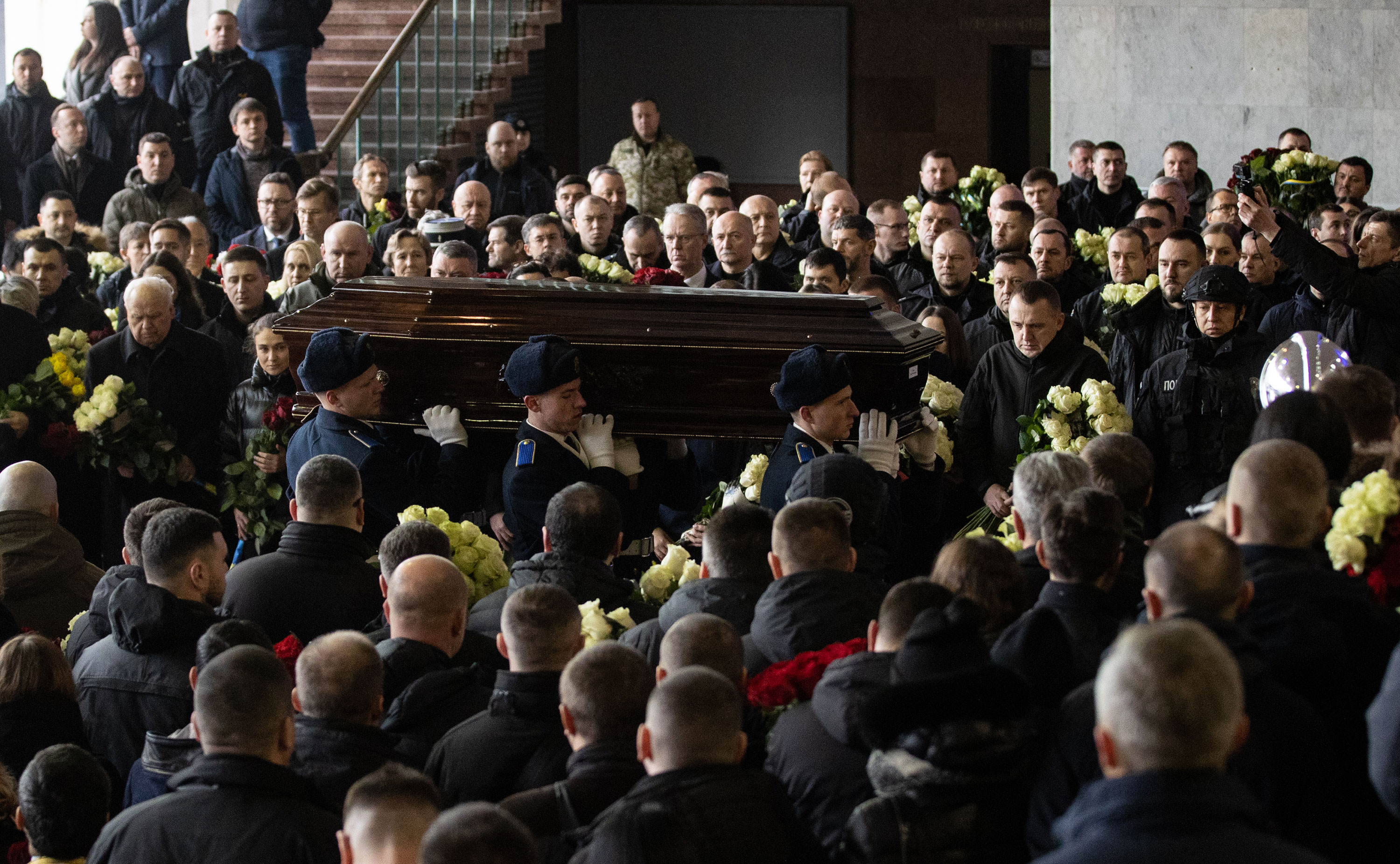 A funeral ceremony is held for the victims of helicopter crash in the city of Brovary on Saturday in Kyiv. 