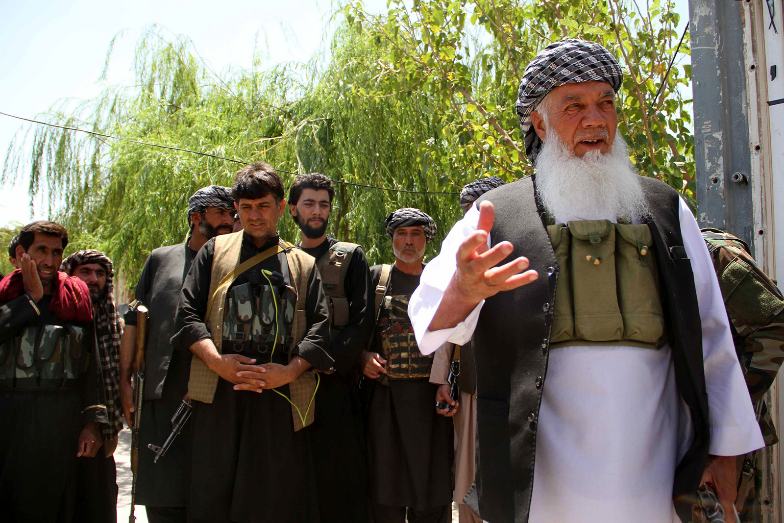 Mohammad Ismail Khan, right, pictured in Herat on August 6.