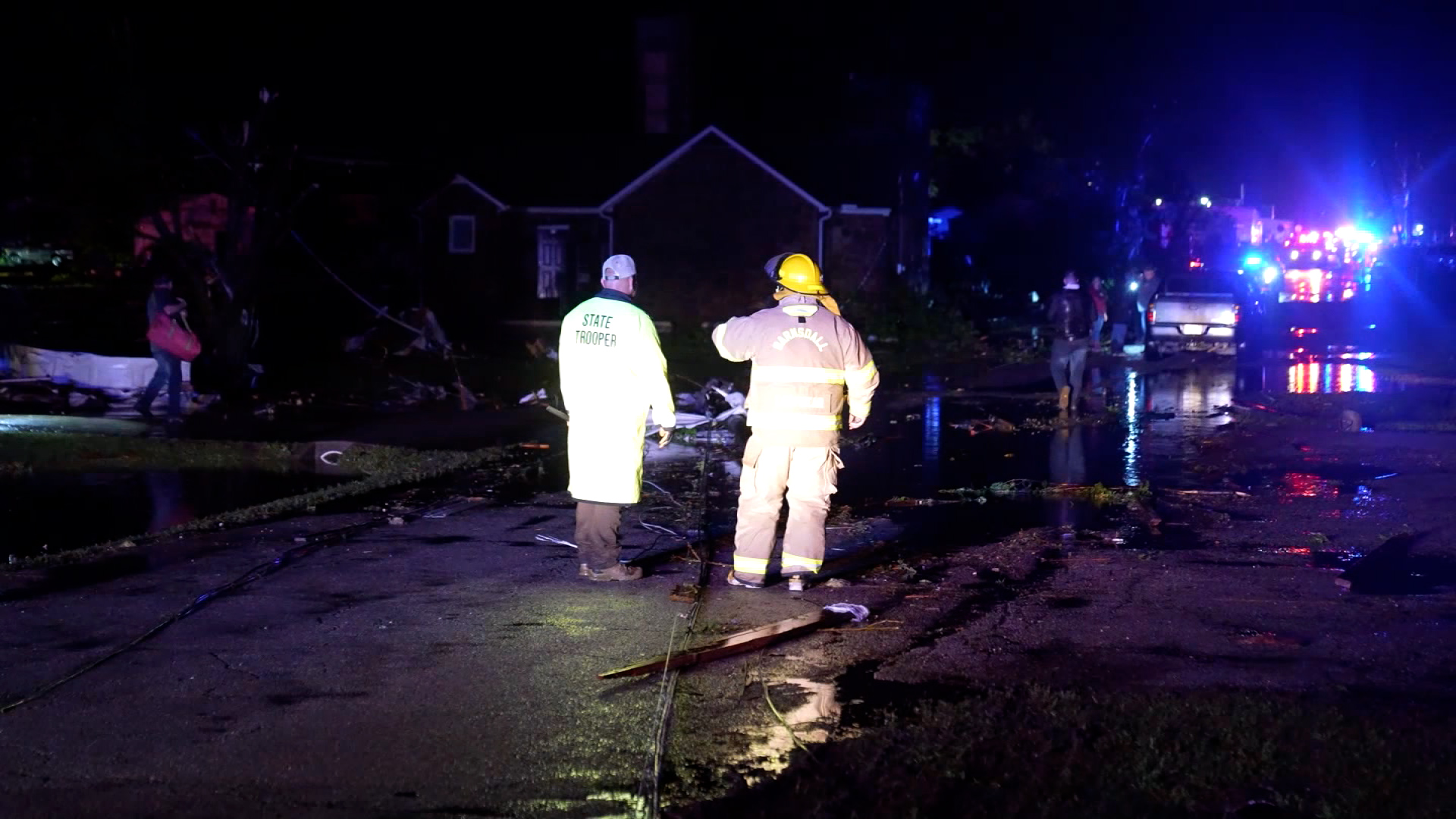 Emergency crew members assess damage in Barnsdall, Oklahoma.