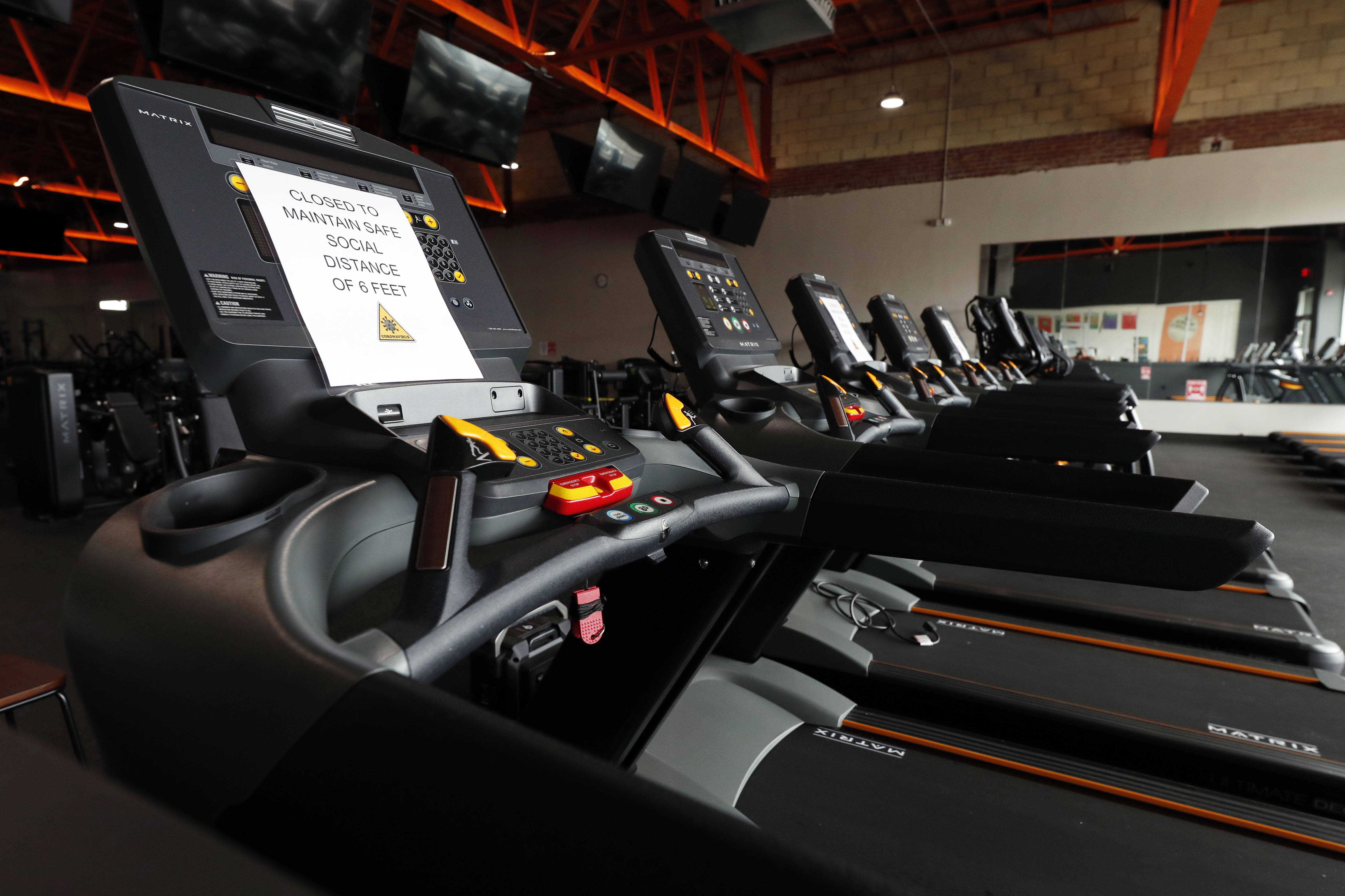 Some elliptical machines and treadmills are disconnected to provide distance at Fondren Fitness in Jackson, Mississippi, on May 14. The city of Jackson is allowing gyms and fitness centers to reopen with restrictions on May 15.