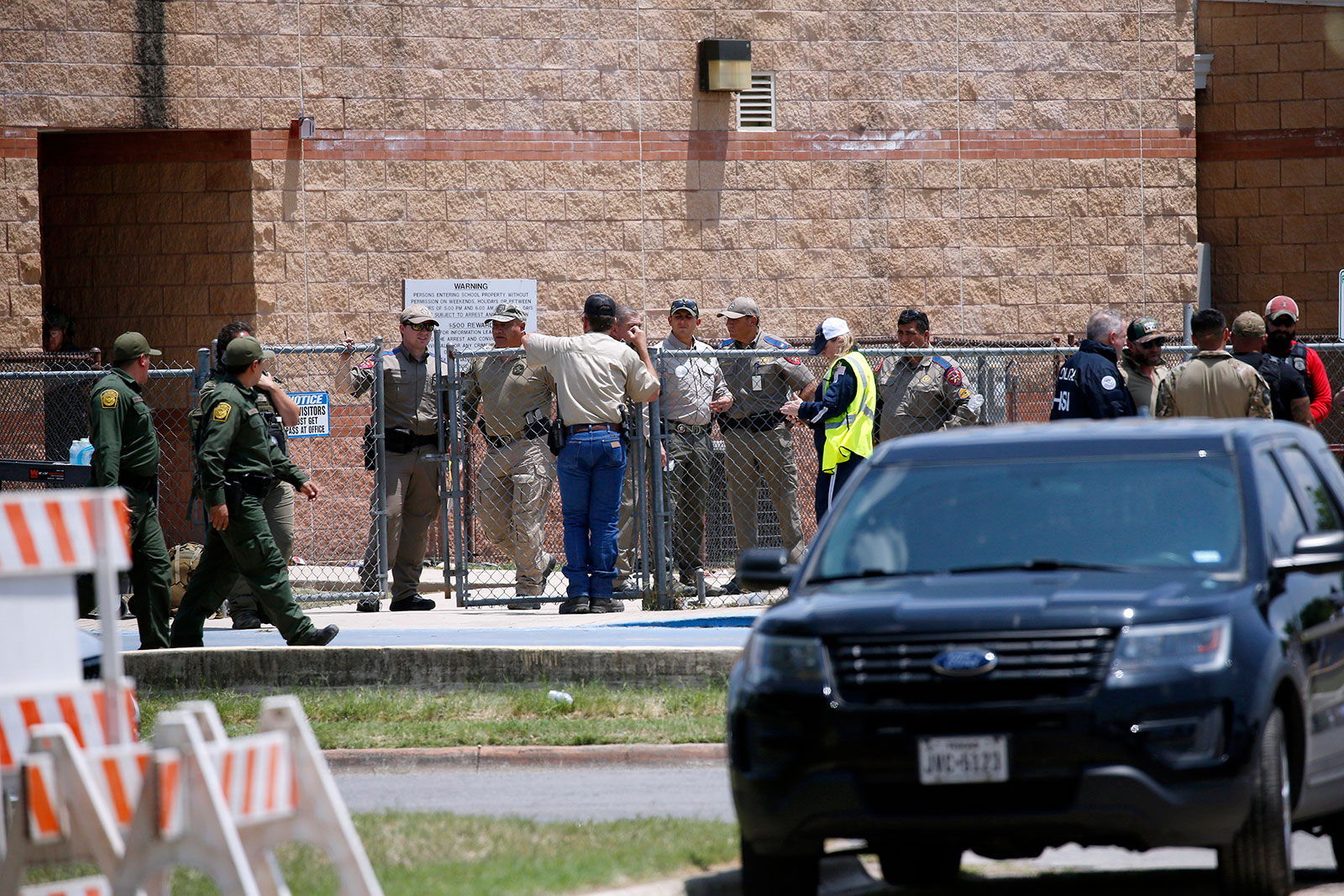 Law enforcement and other first responders gather outside Robb Elementary School following a shooting on May 24, in Uvalde, Texas.