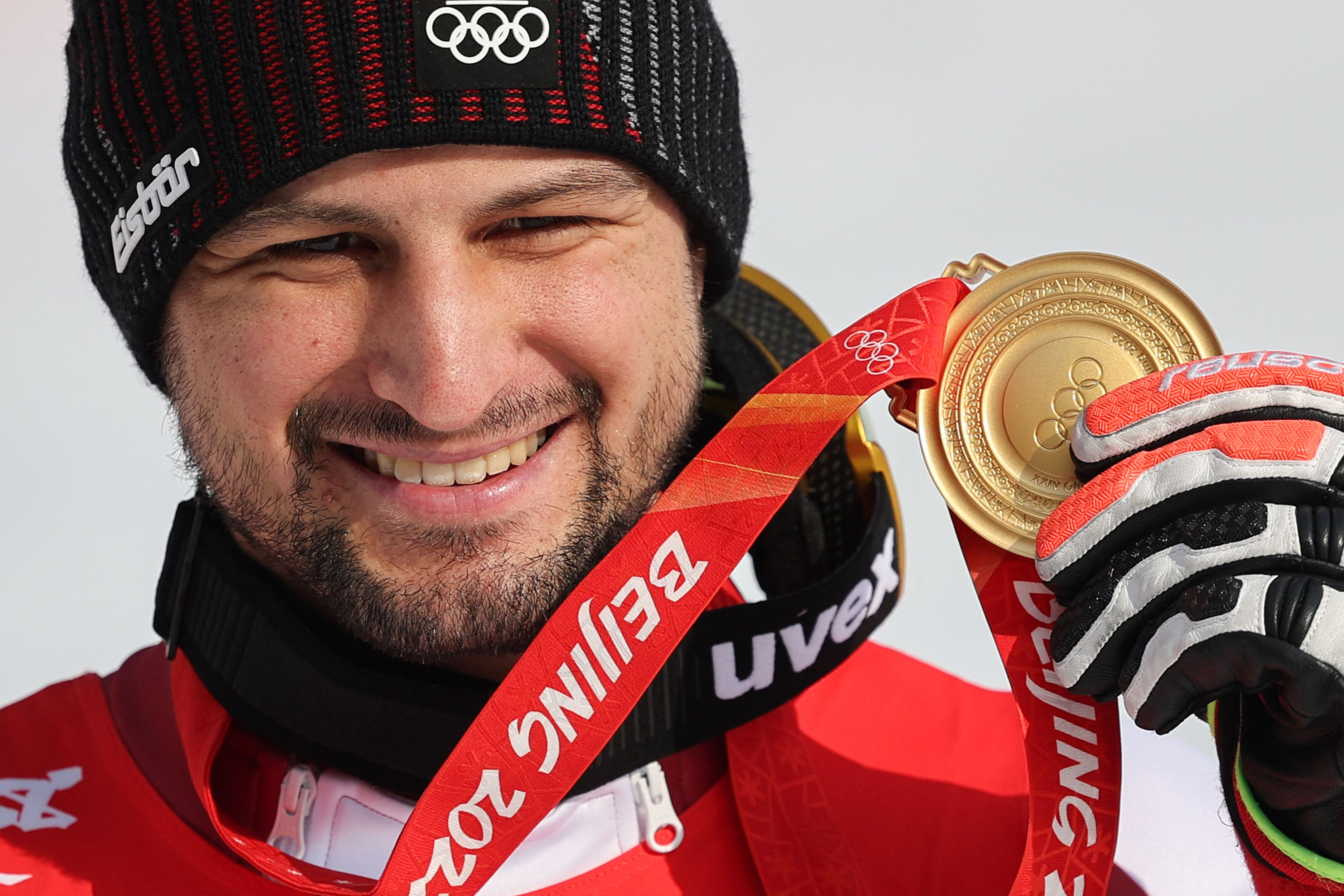 Johannes Strolz shows off his gold medal on Thursday.