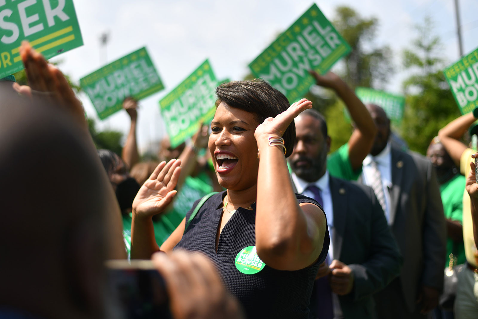 Mayor Muriel Bowser receives a warm welcome form her supporters while arriving to vote at the Turkey Thicket Recreation Center in Washington, DC, on June 16. 