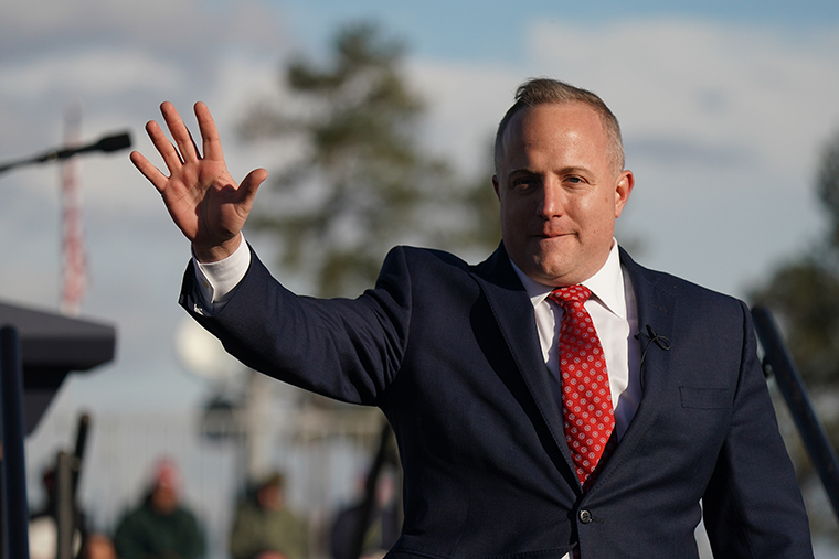 Fry waves to the crowd during a rally with former US President Donald Trump at Florence Regional Airport on March 12, in Florence, South Carolina. 