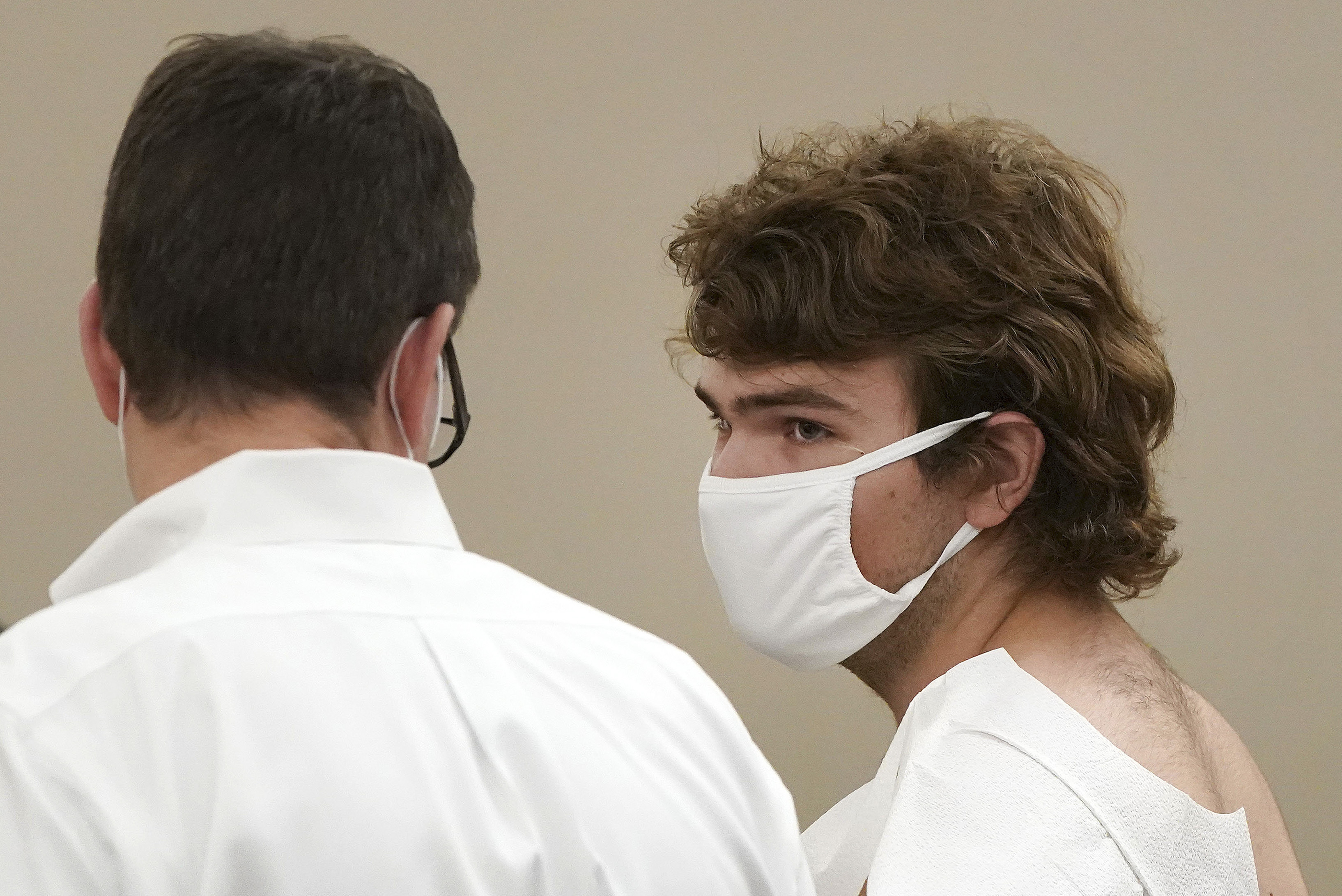 Payton Gendron talks with his attorney during his arraignment in Buffalo City Court, on Saturday, May 14. 