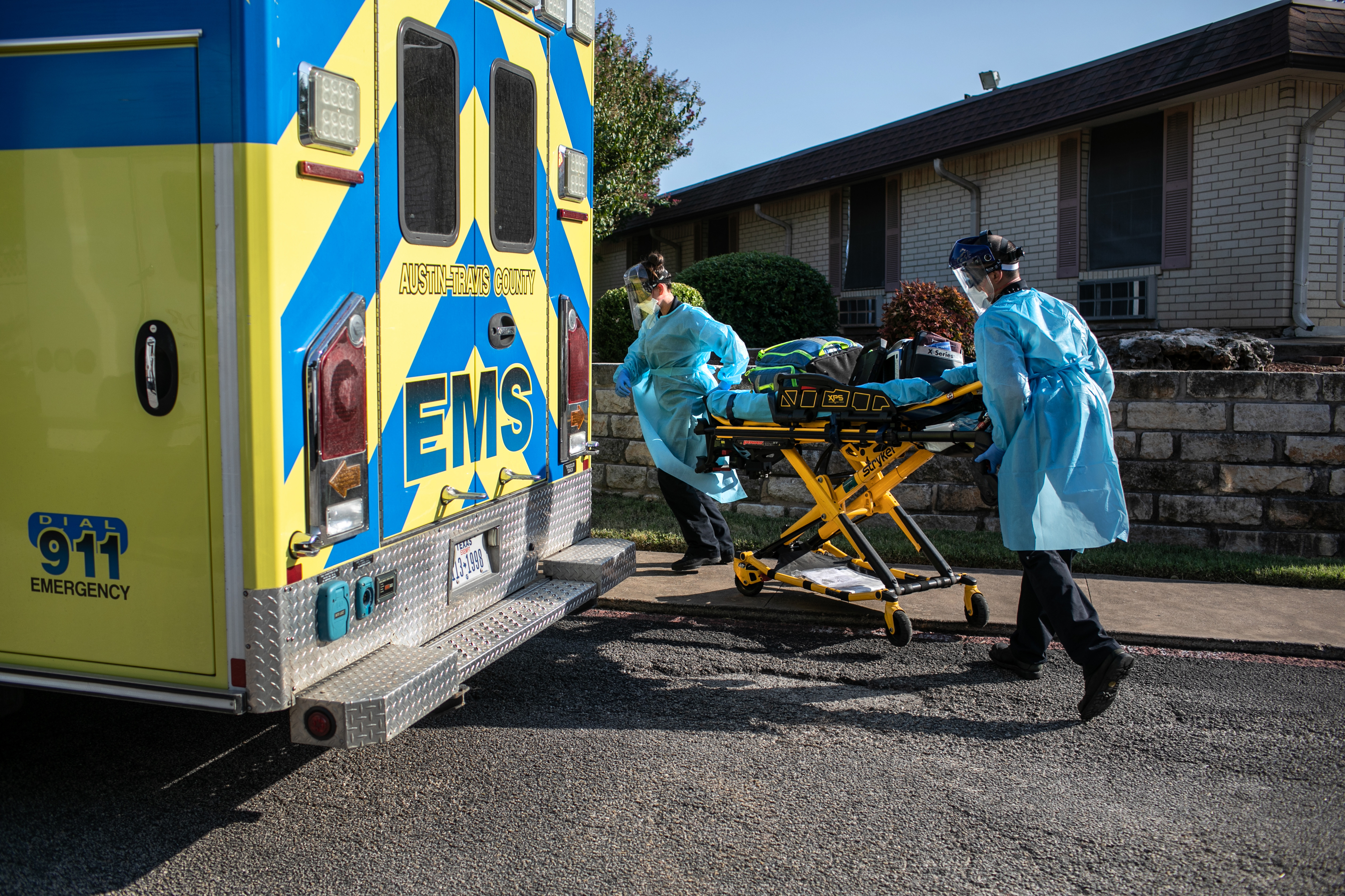 Austin-Travis County medics prepare to enter a nursing home on August 5 in Austin, Texas. 