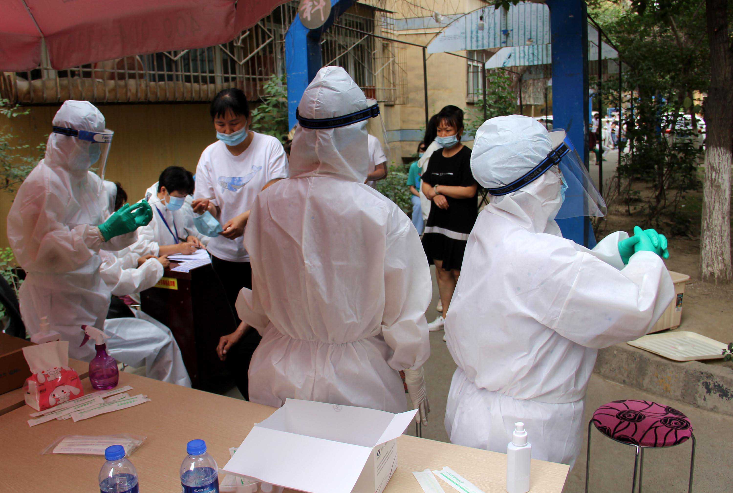 Residents undergo nucleic acid testing in Urumqi, in the Xinjiang Uyghur Autonomous Region of China, on July 19.