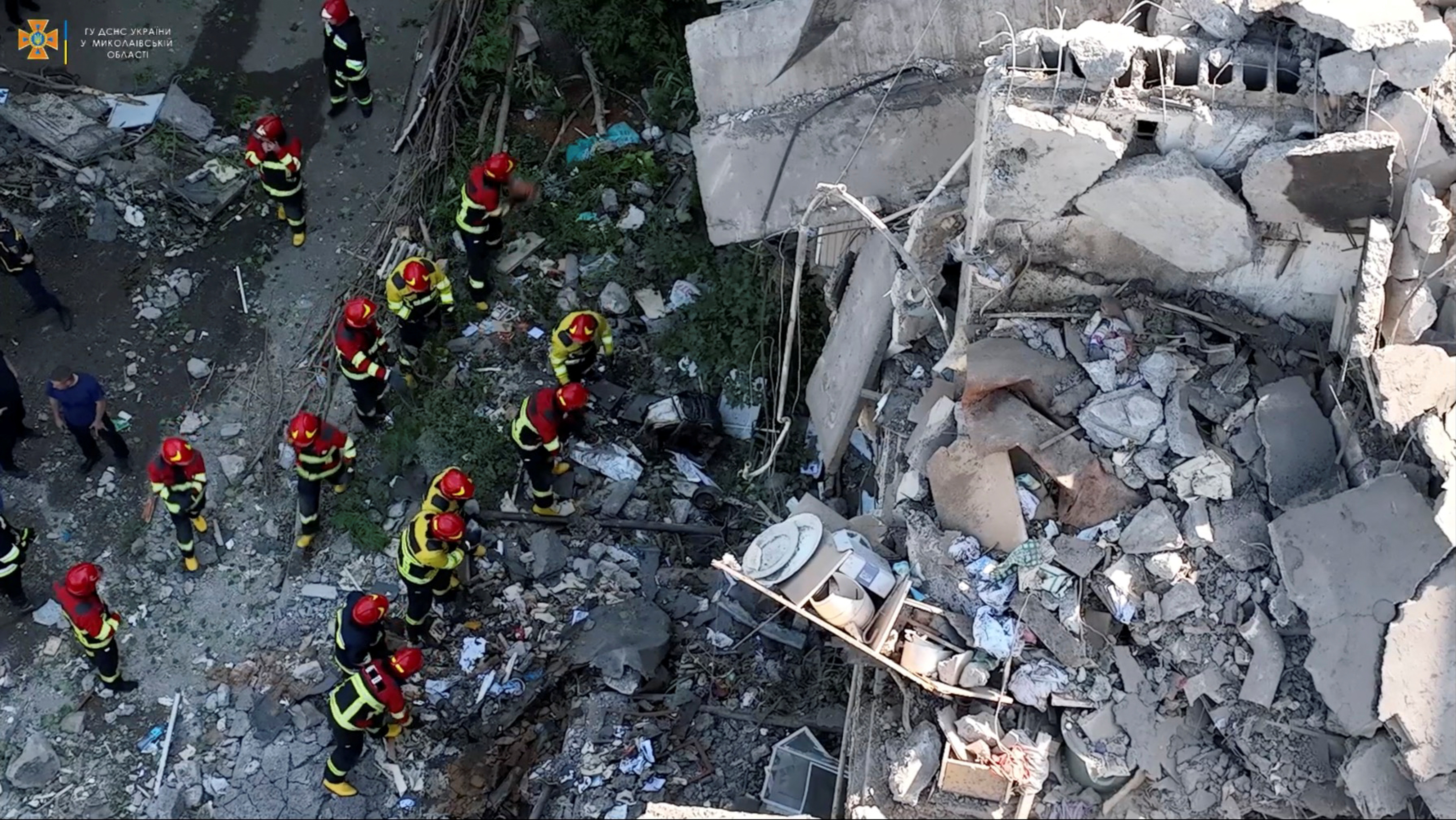 Rescuers work at a residential building hit by a Russian military strike in Mykolaiv, Ukraine, on June 29.