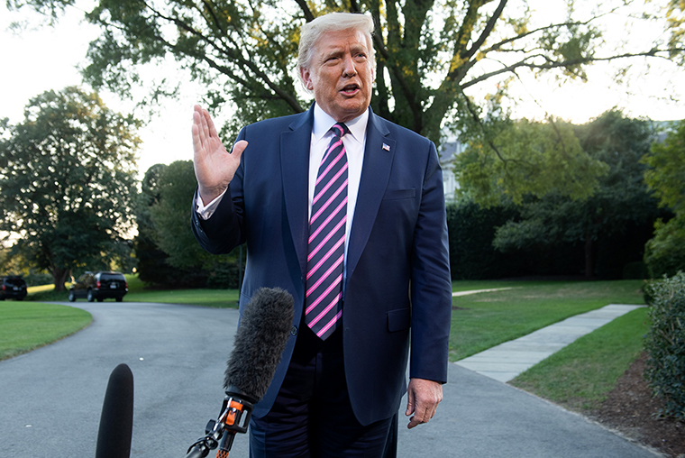 President Donald Trump speaks to the press as he departs the White House in Washington, DC, on Tuesday, September 22.