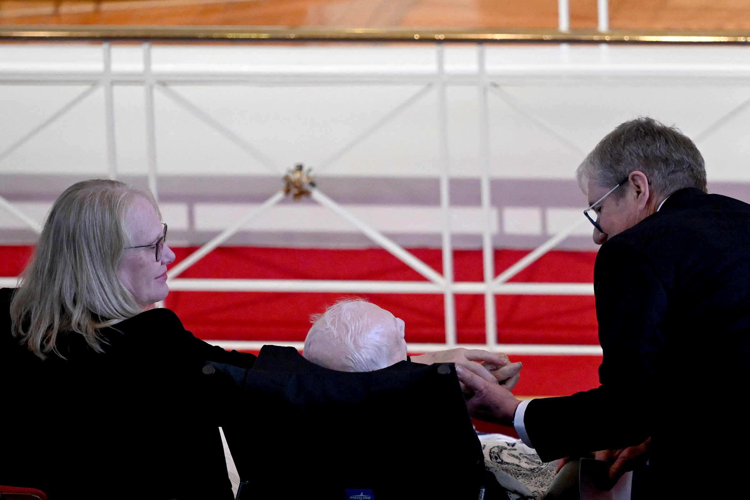 James "Chip" Carter and Amy Carter hold hands near their father, former President Jimmy Carter, during a tribute service for former first lady Rosalynn Carter at Glenn Memorial Church in Atlanta on November 28. 