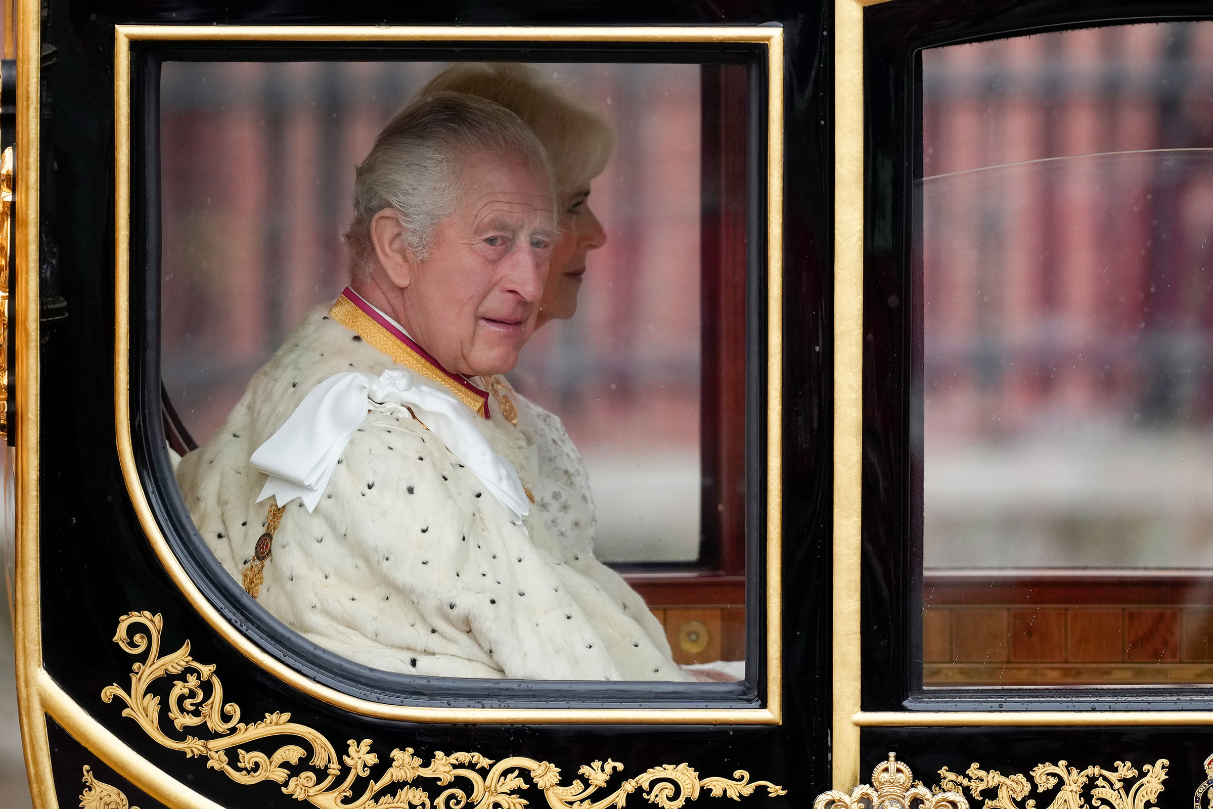 King Charles III and Camilla, Queen Consort traveling in the Diamond Jubilee Coach built in 2012 to commemorate the 60th anniversary of the reign of Queen Elizabeth II at Buckingham Palace ahead of the Coronation of King Charles III and Queen Camilla on Saturday in London. 