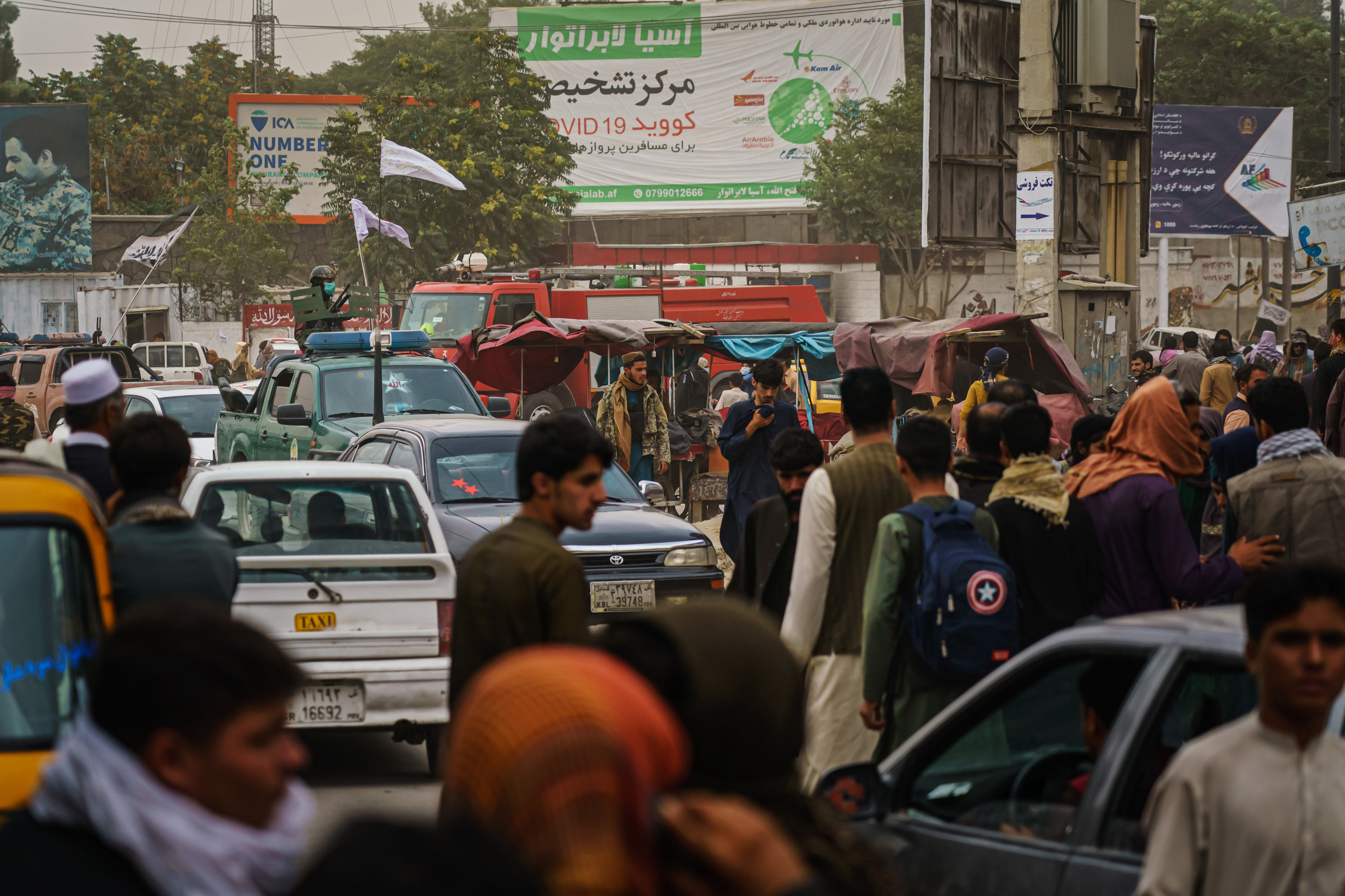 Afghans gather outside Kabul Airport on August 17.