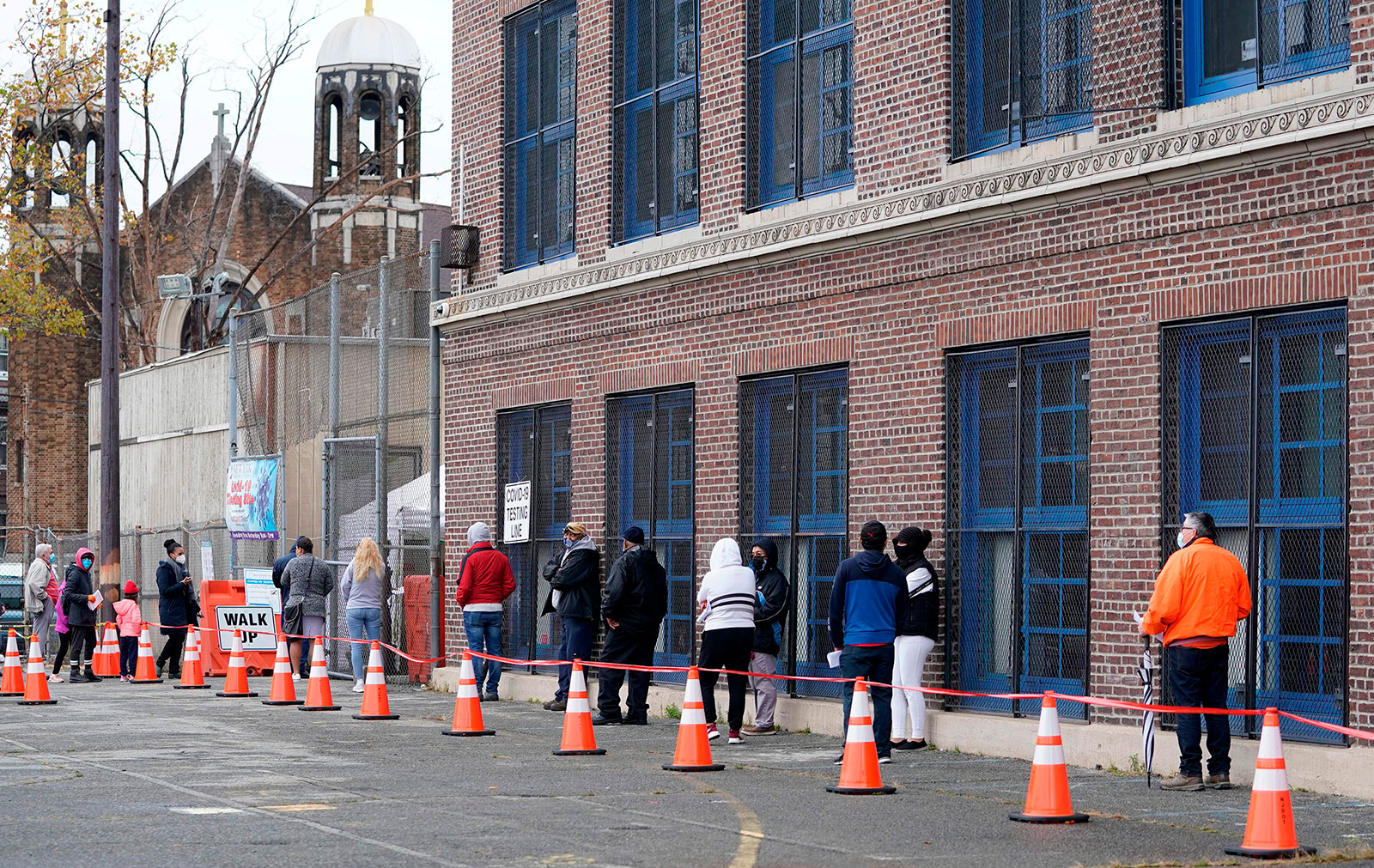 People wait in line to get tested for Covid-19 in Newark, New Jersey, on November 12.