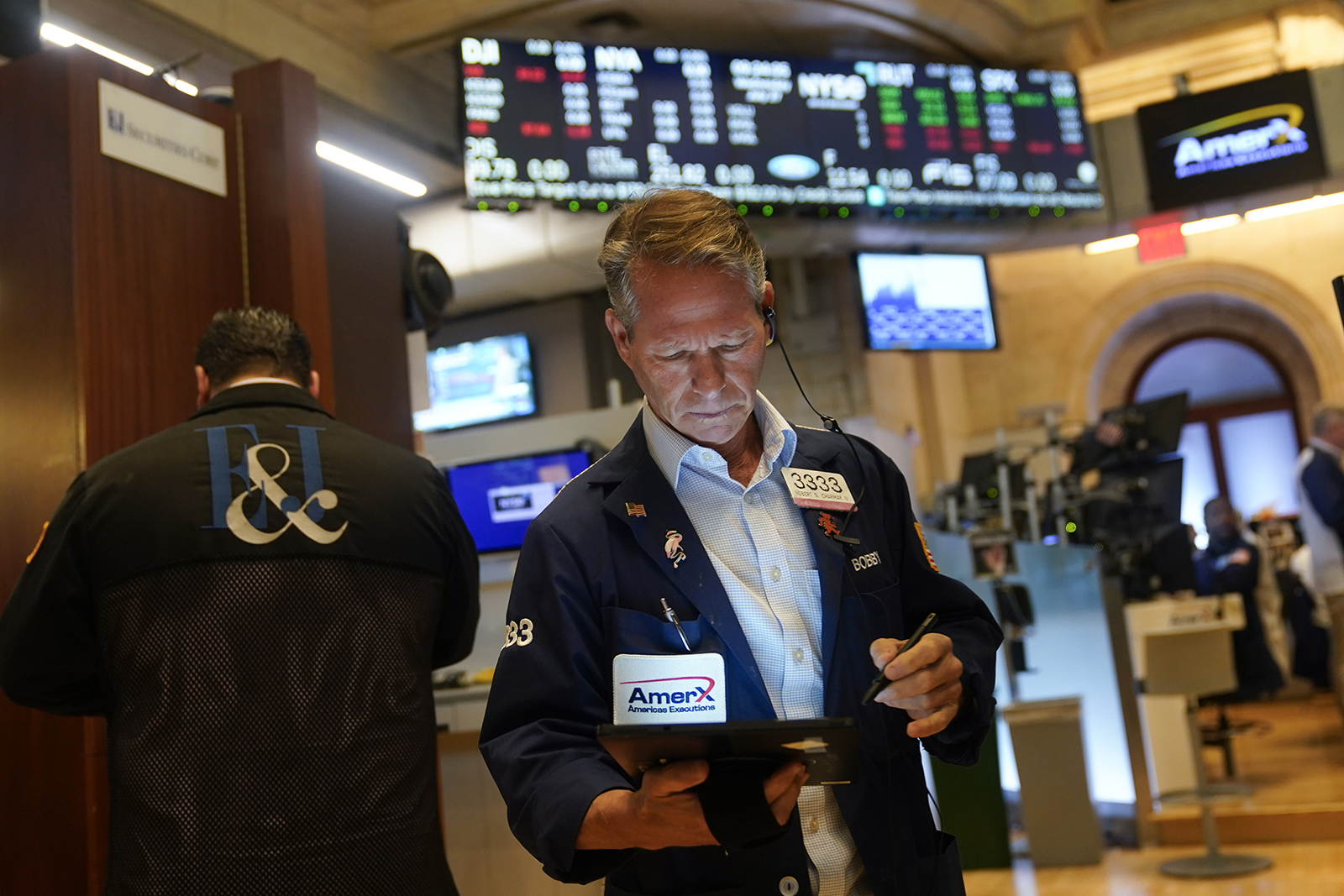 Traders work on the floor of the New York Stock Exchange on Wednesday, July 27.