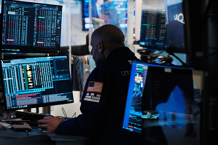 Traders work on the floor of the New York Stock Exchange on February 14 in New York City. 