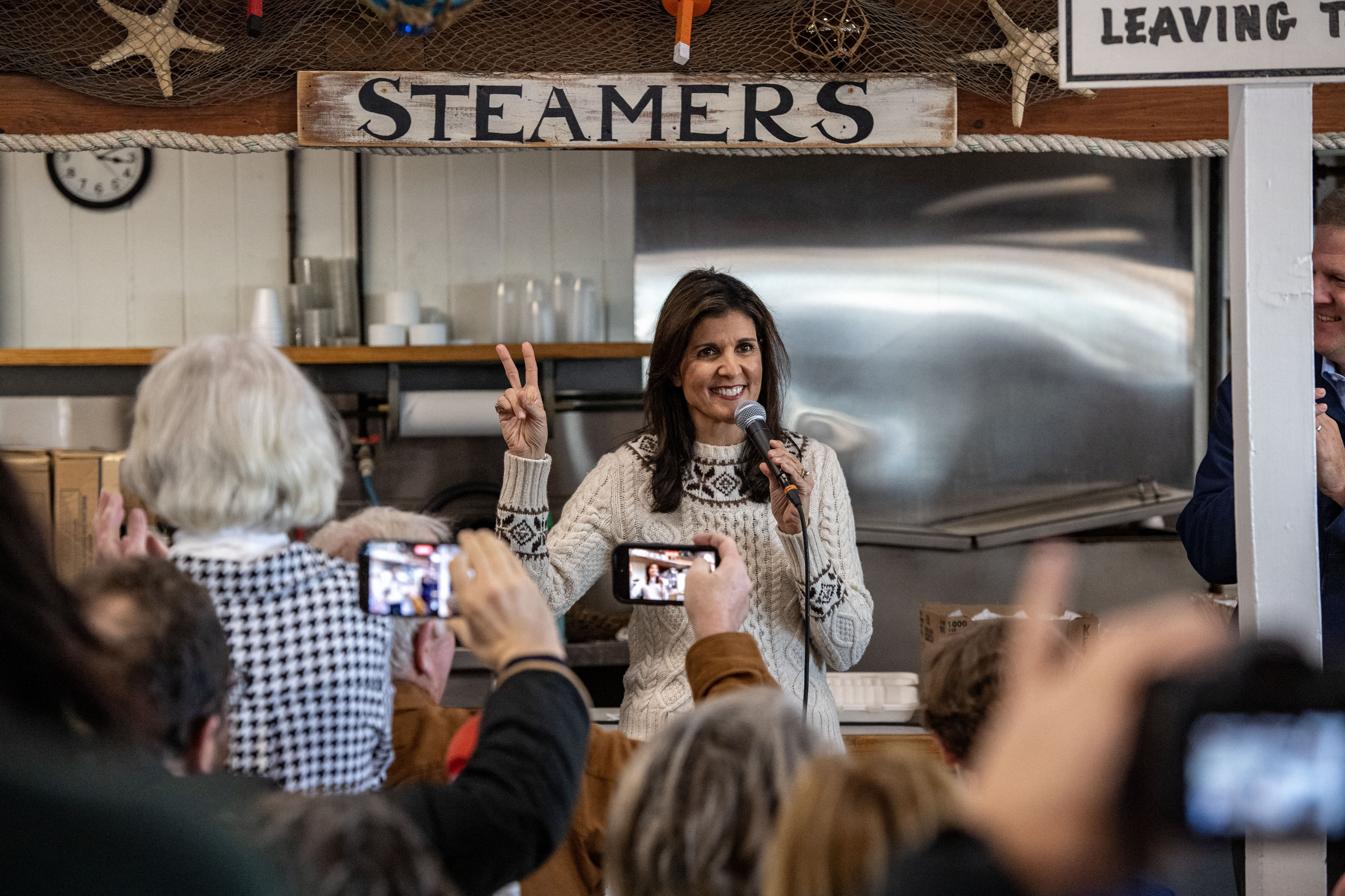 Republican presidential candidate Nikki Haley holds up two fingers as she speaks in Seabrook, New Hampshire, on January 21. Haley addressed the news of Florida Gov. Ron DeSantis dropping out of the presidential race, gesturing to indicate that it is now a two-person race.